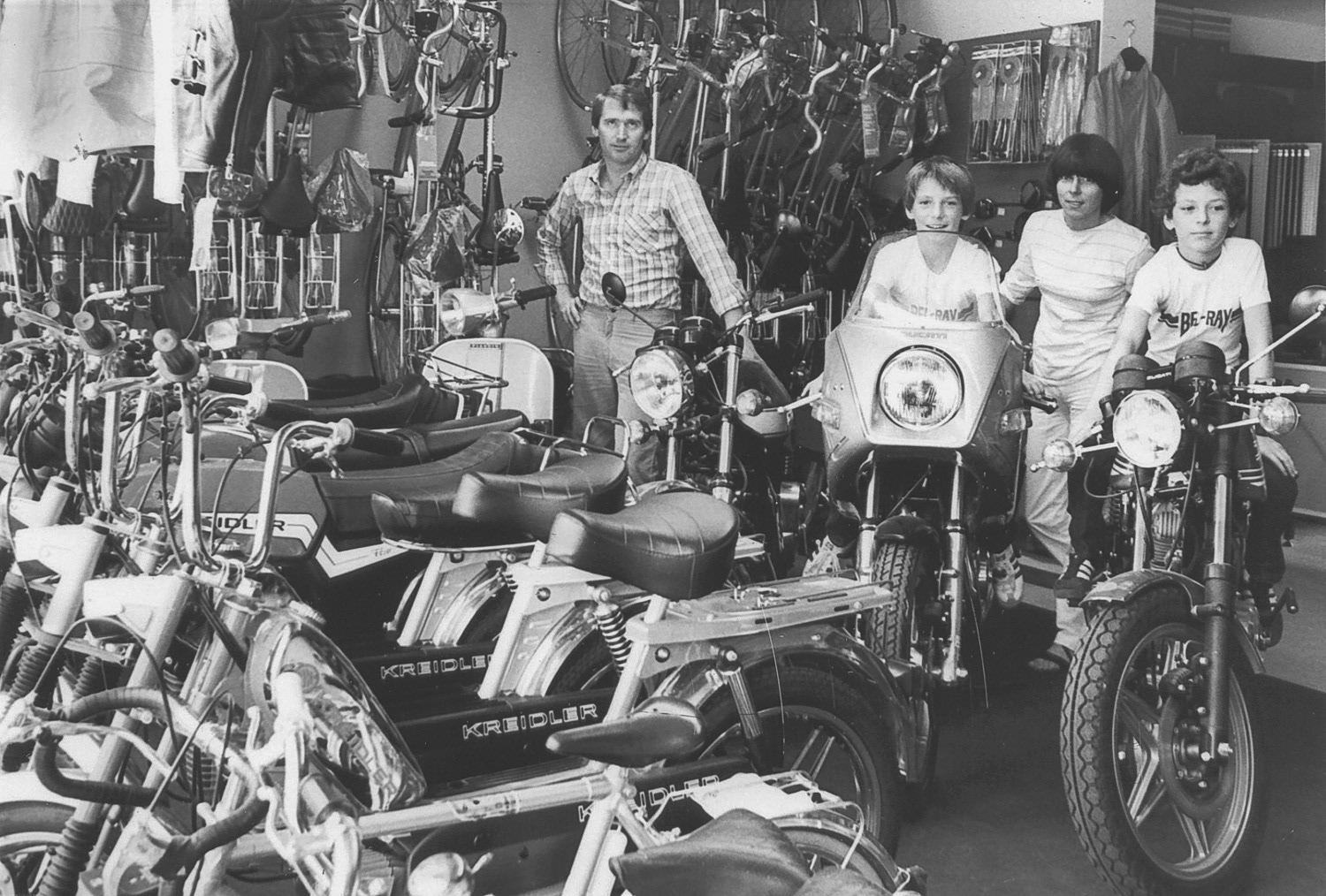 Normen, his brother Heiko and their parents in the shop.