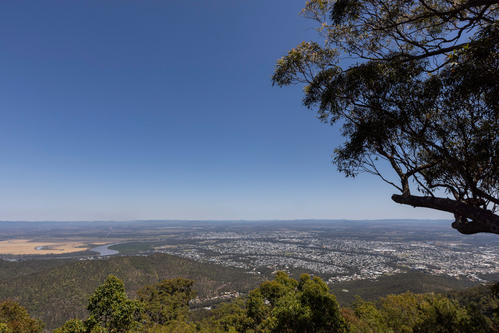 Birdseye from Mount Archer Rockhampton, Central Queensland. From the top of Mount Archer, the sweeping view of Rockhampton reveals a region on the rise, both in natural beauty and economic opportunity. Rockhampton is strategically positioned for major developments in solar, wind and hydrogen energy. With its proximity to key infrastructure and a strong local workforce, the region is poised to lead Australia’s energy transformation, blending its rich history with a future powered by clean energy innovation.