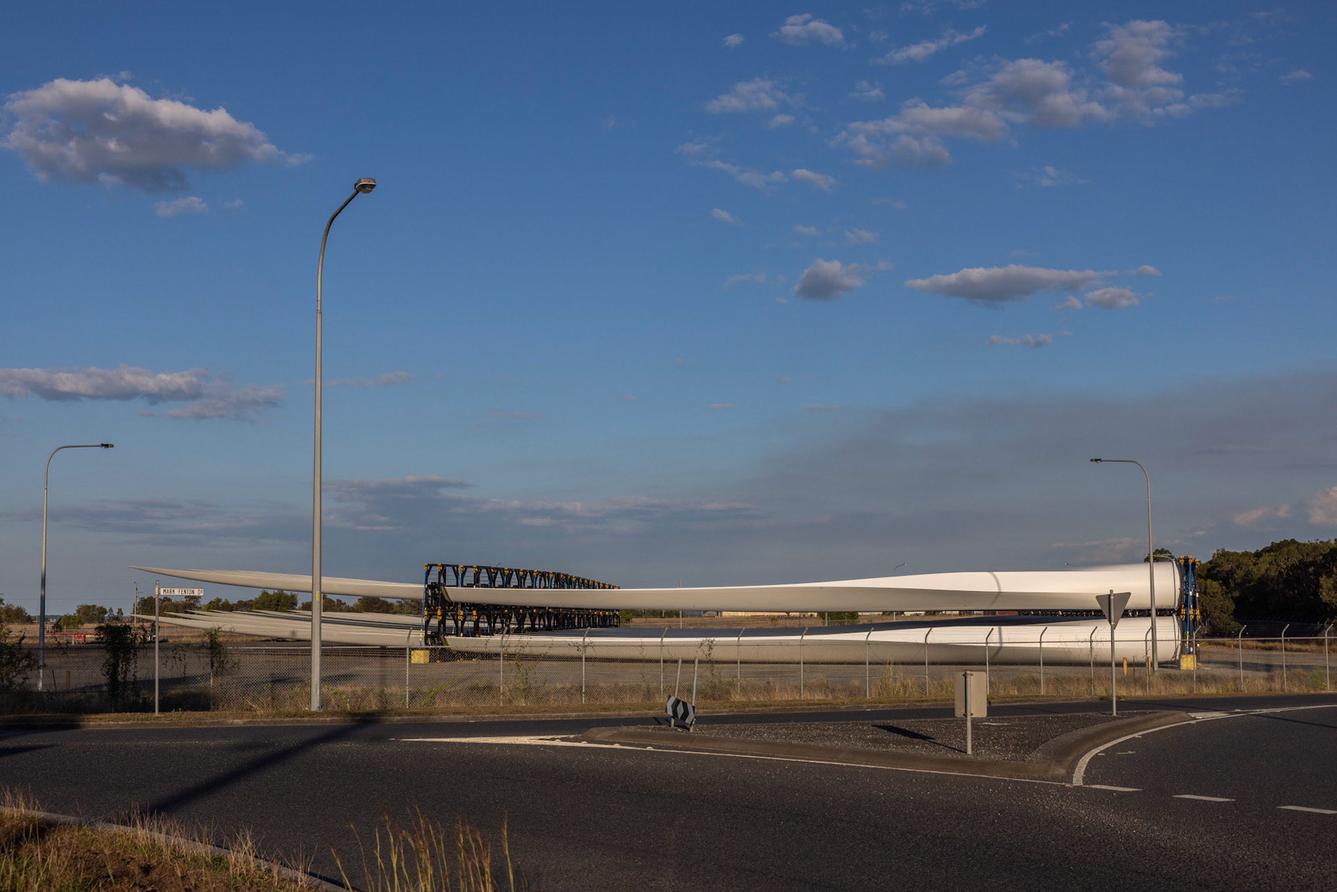 Wind turbine blades Gladstone. The striking wind turbine blades resting in a vacant lot in Gladstone’s industrial sector are a constant reminder of the region’s commitment to embracing renewable energy technologies. As Central Queensland pivots towards a sustainable future, the soon to be built wind turbines represent the potential for harnessing wind energy and reducing carbon emissions.