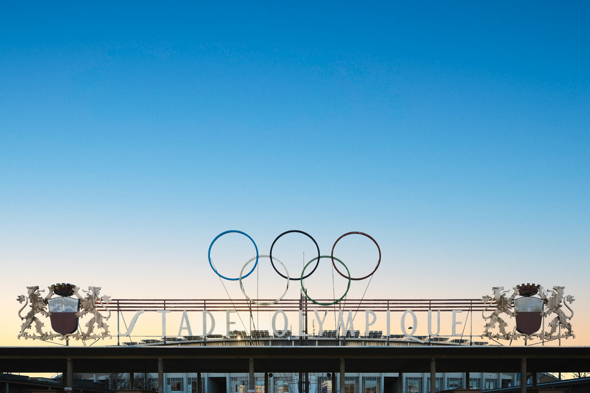 Sunset behind the Olympic Rings at the Stade Olympique de la Pontaise entrance
