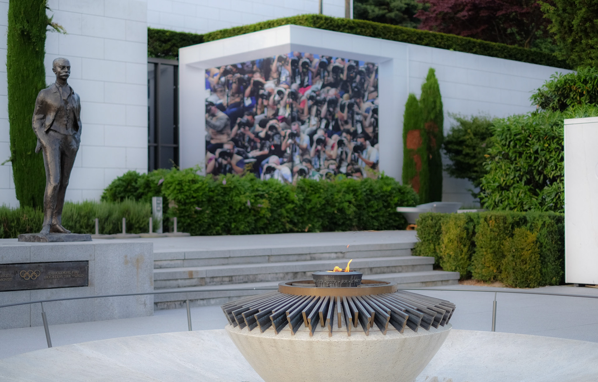 Olympic Flame in front of the Olympic Museum - cauldron in marble and bronze by André Ricard