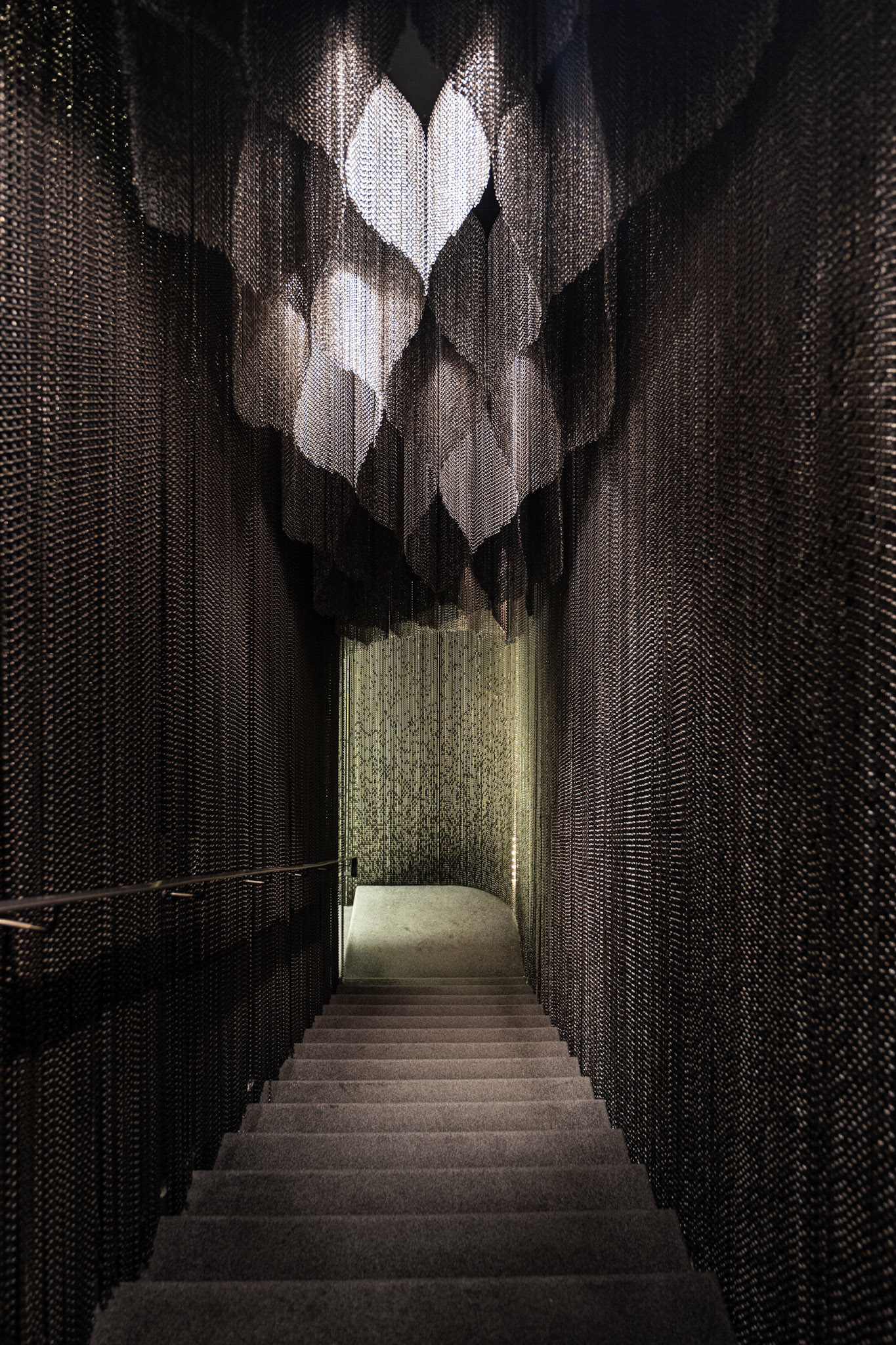 staircase with Kengo Kuma designed mesh curtain