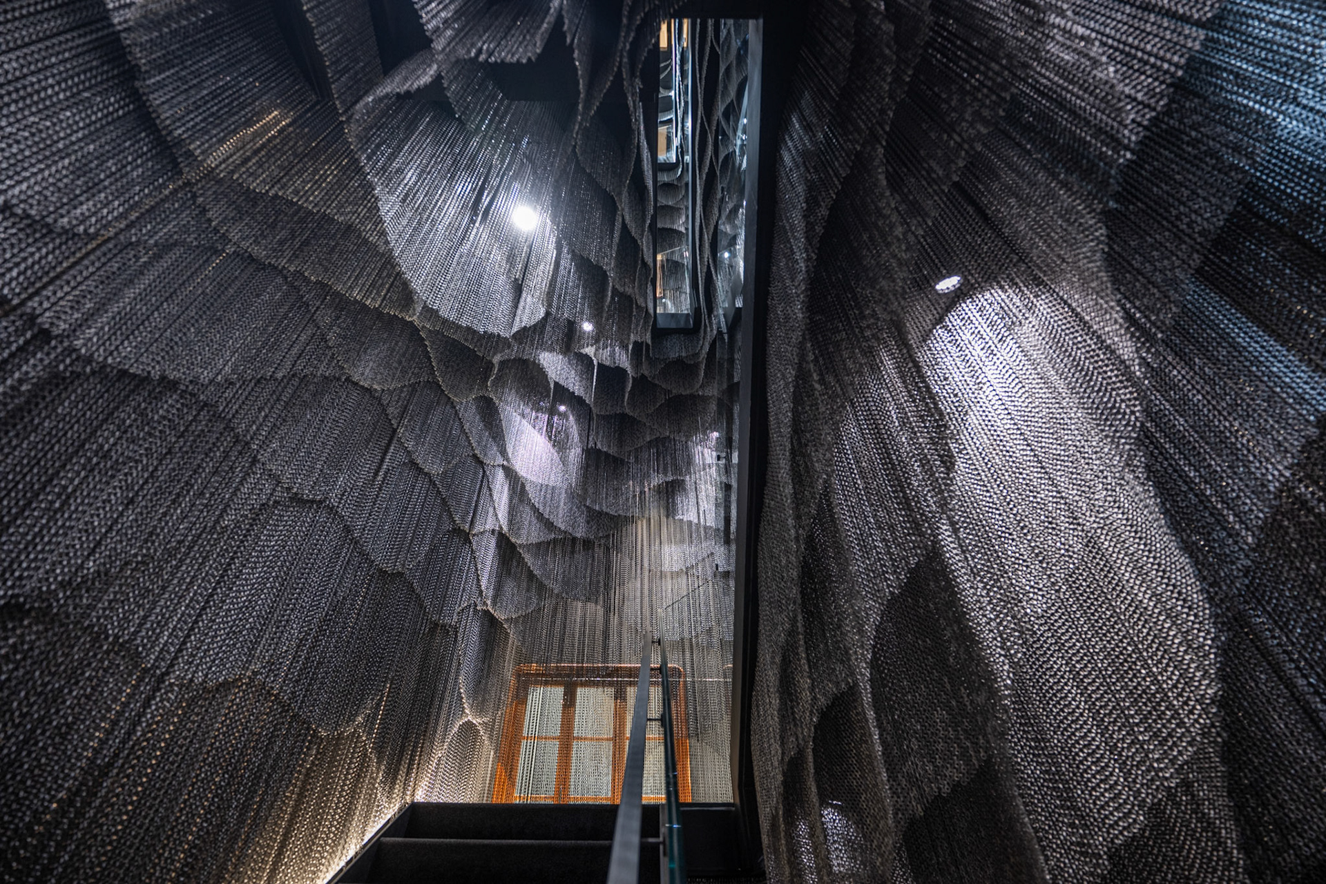 staircase with Kengo Kuma designed mesh curtain