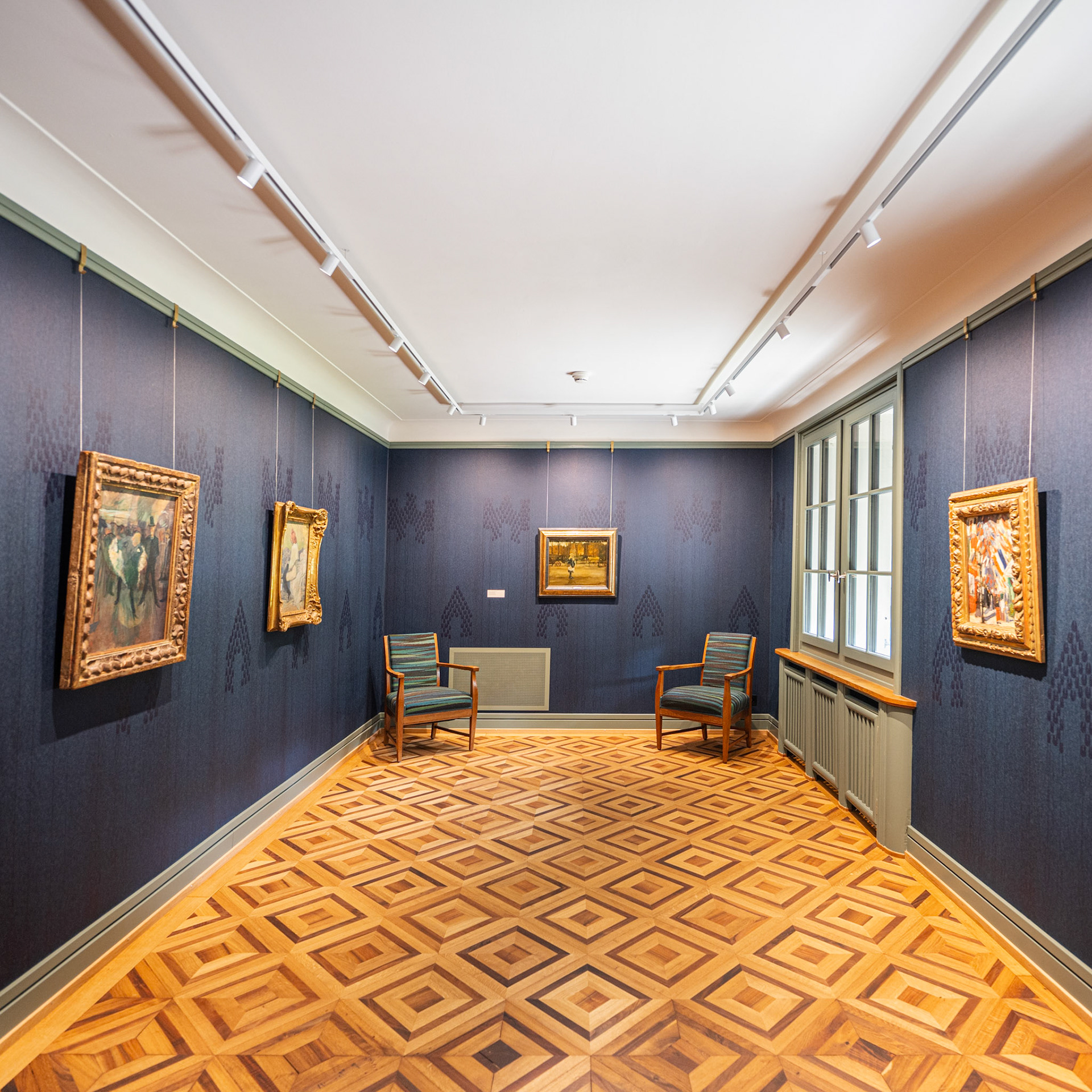 room with paintings by Van Gogh