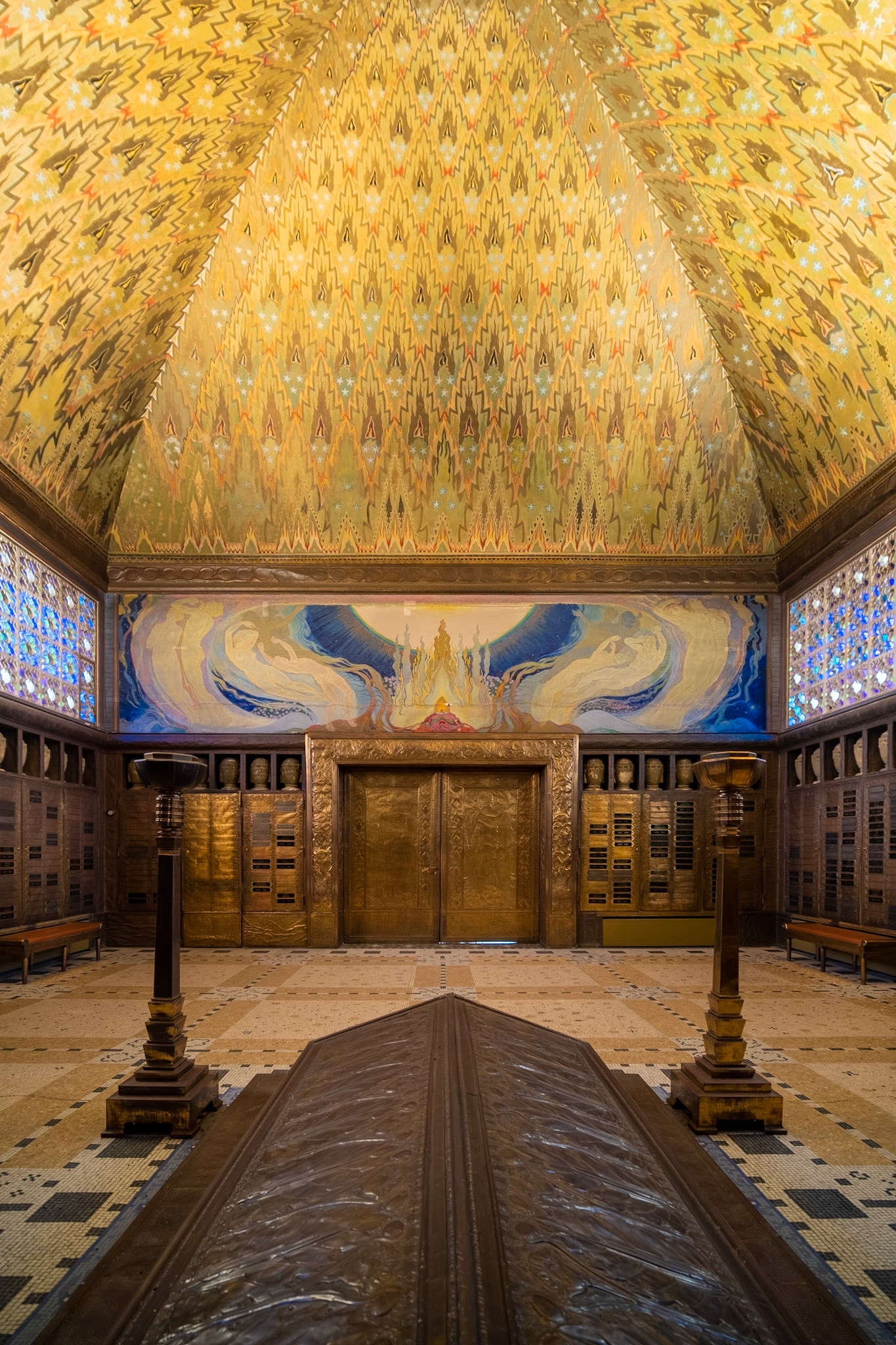 mural above the exit doors: "La Purification par le Feu"