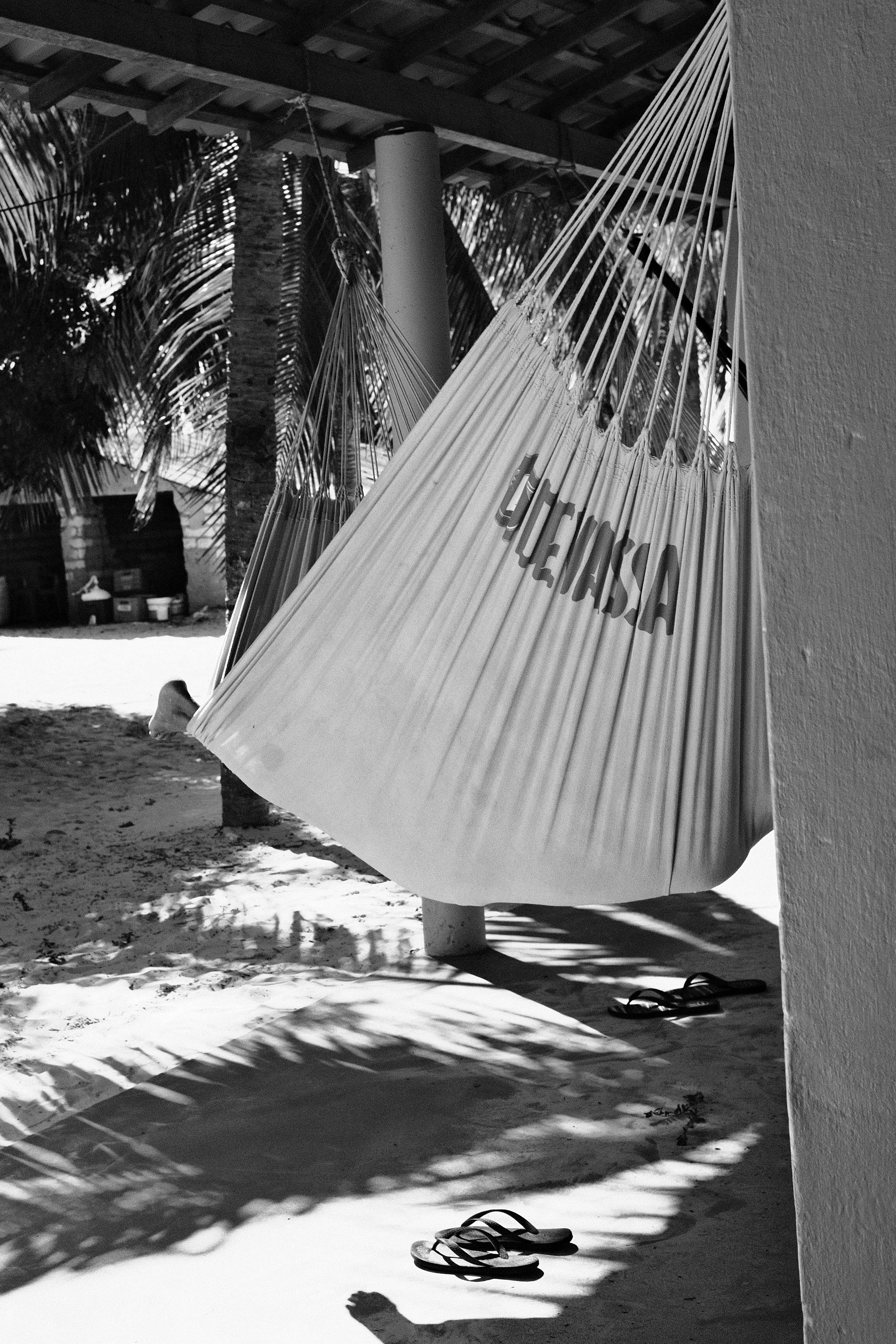 A guide sleeps in a hammock.
