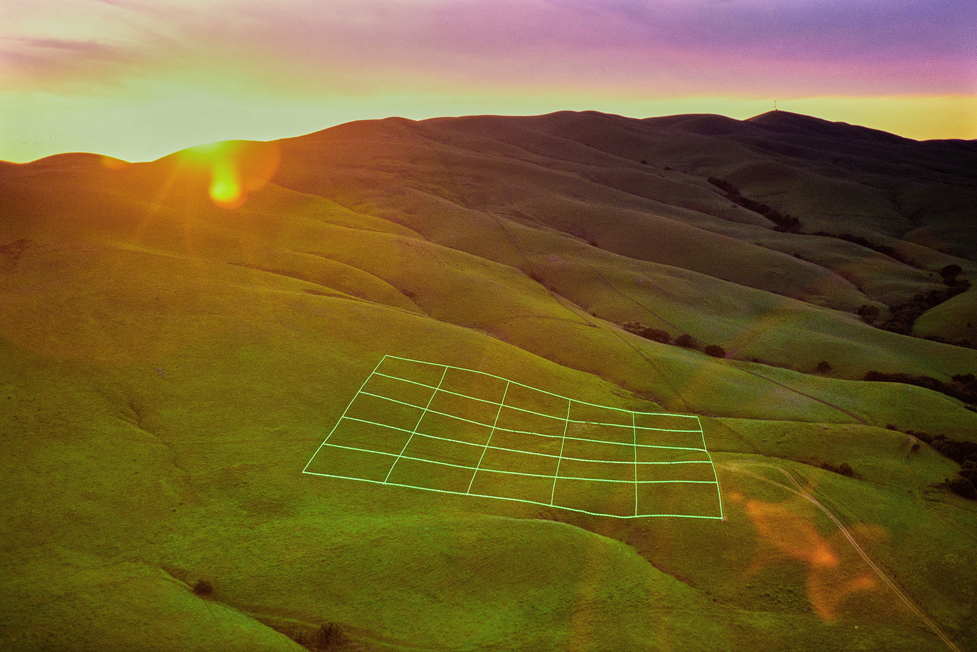 Aerial twilight view of Luminous Earth Grid, a monumental site-specific light installation by artist, Stuart Williams