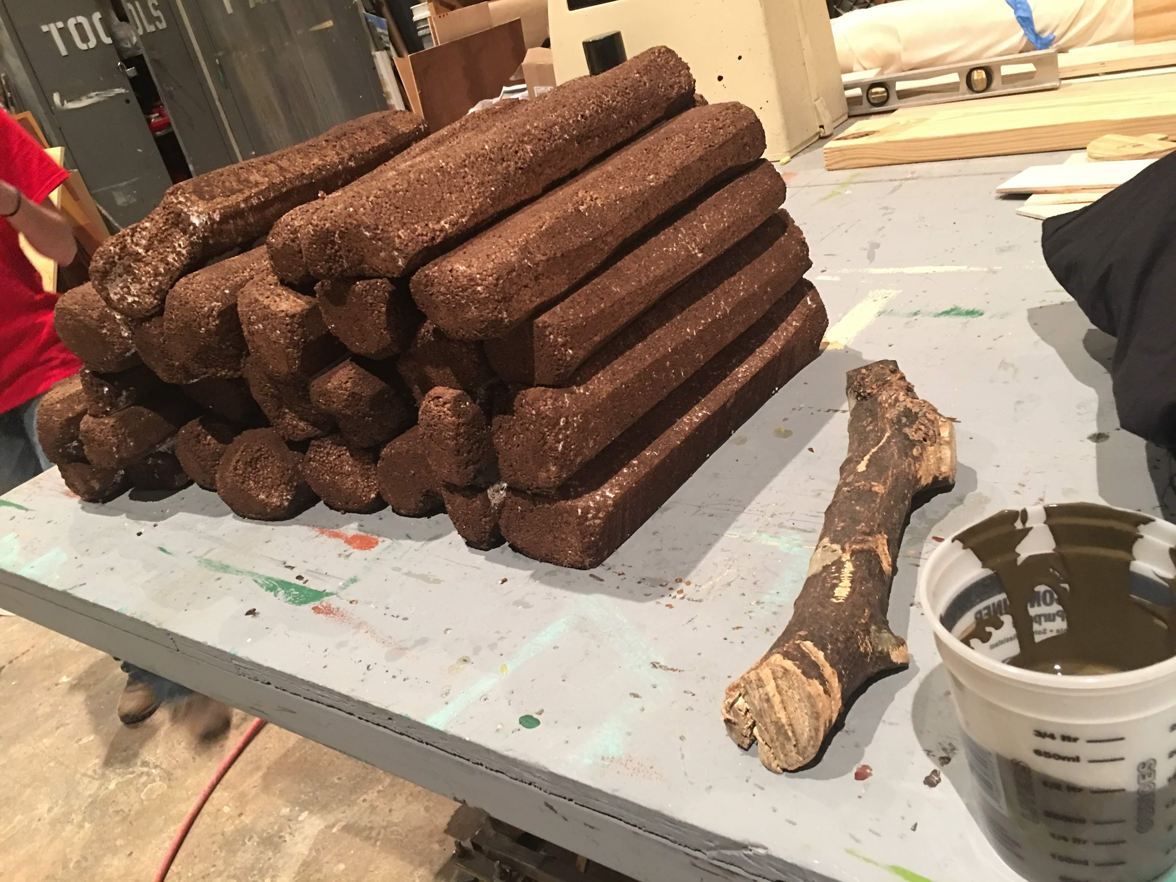 A primed "stack of logs" that I was asked to make look like the reference log next to it.