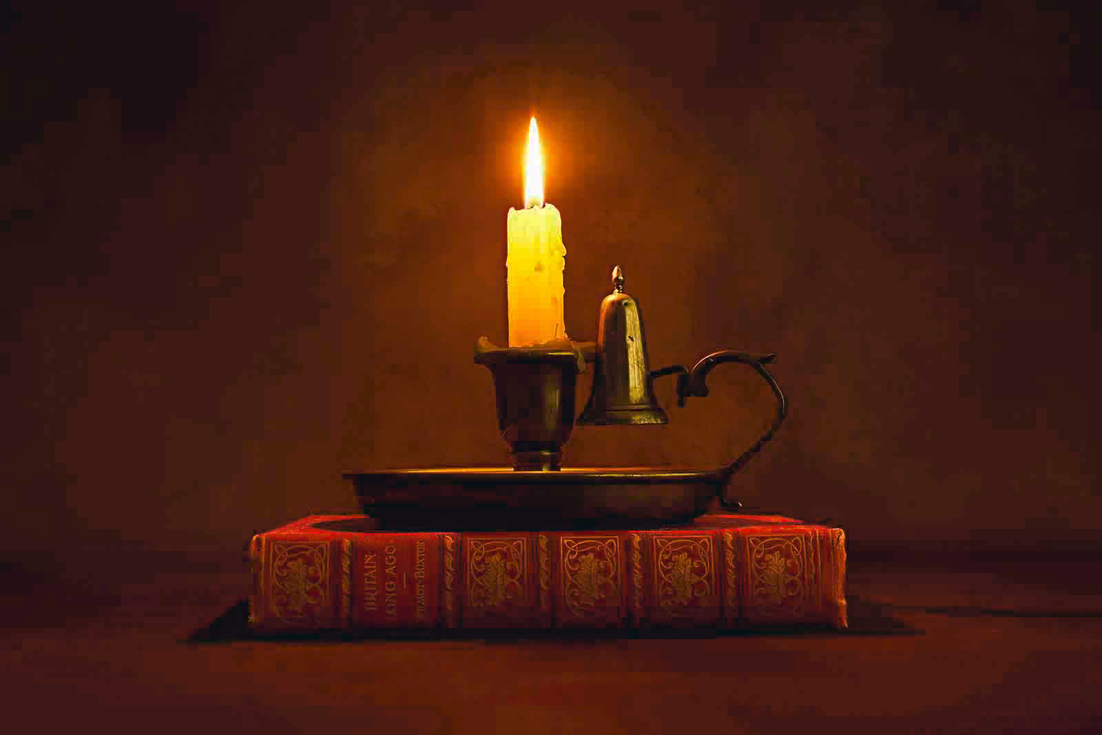 Commended Candle on a red book by John McNaughton