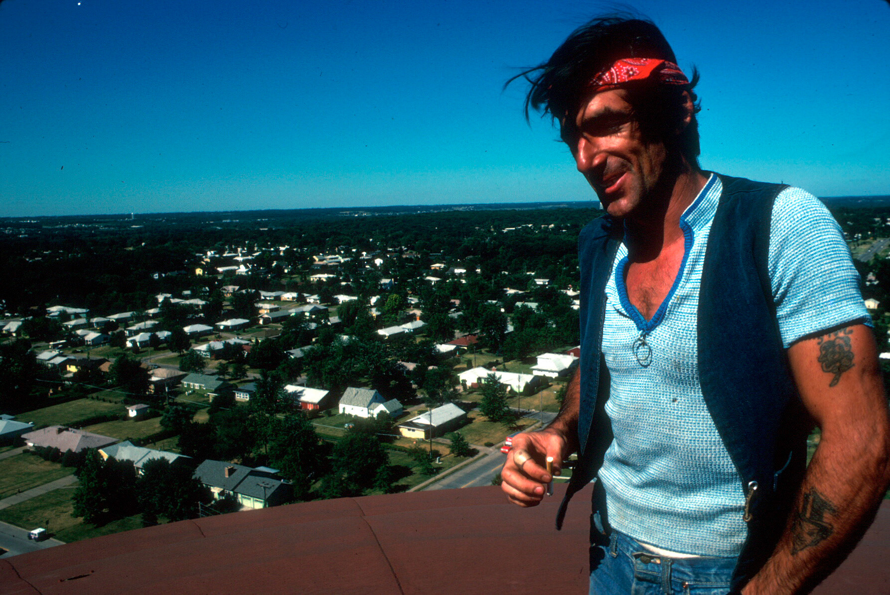Painter on Top of Water Tower