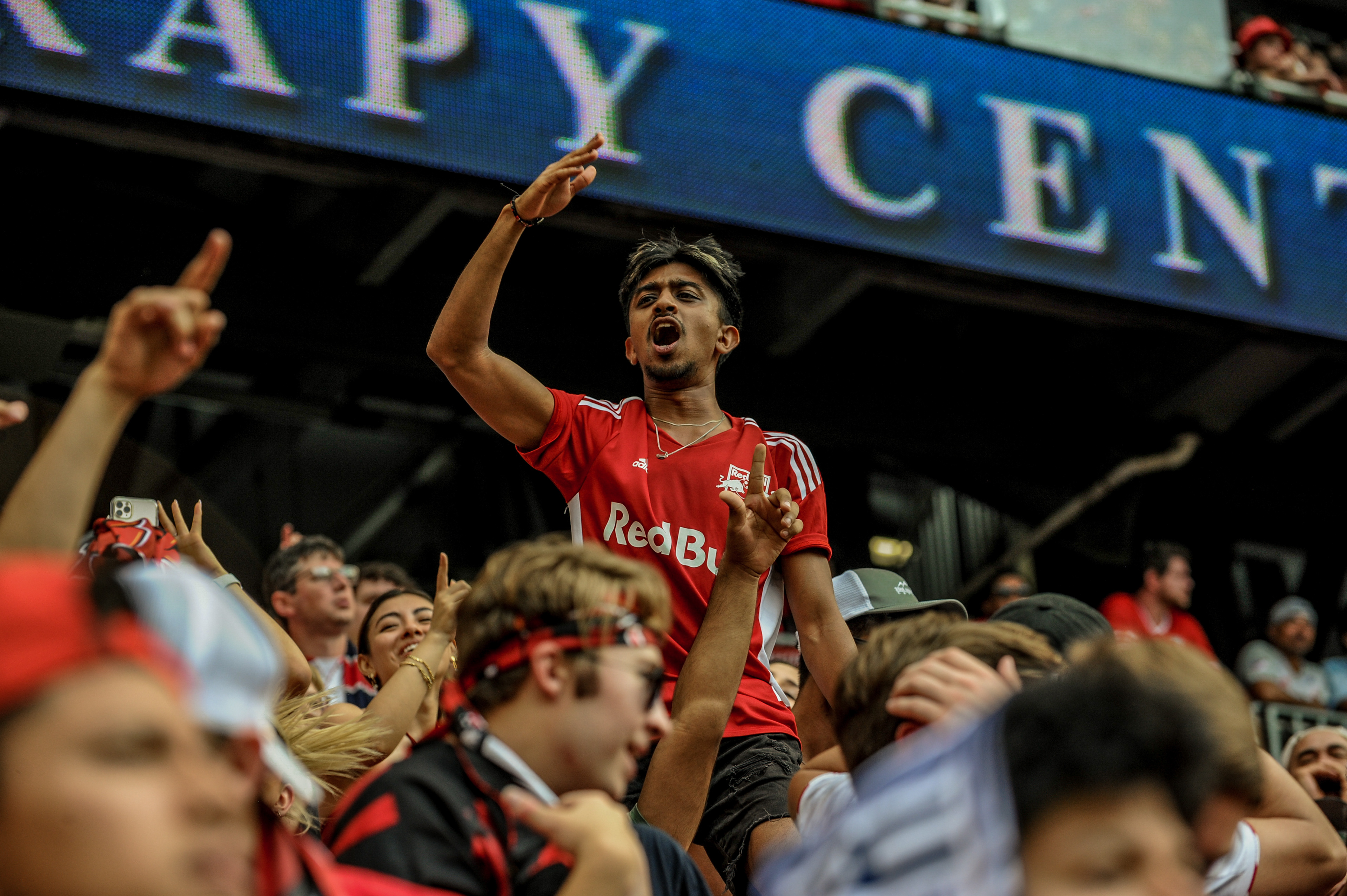 Fan Cheering in the Supporters' Section