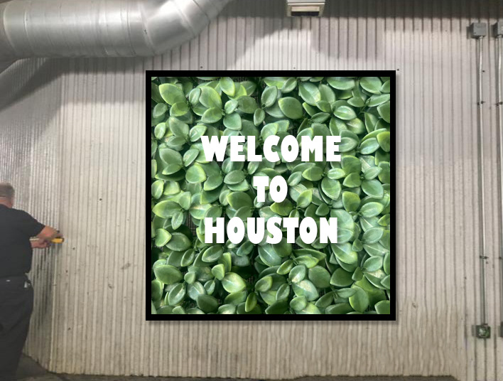 "Welcome to Houston" with black frame.