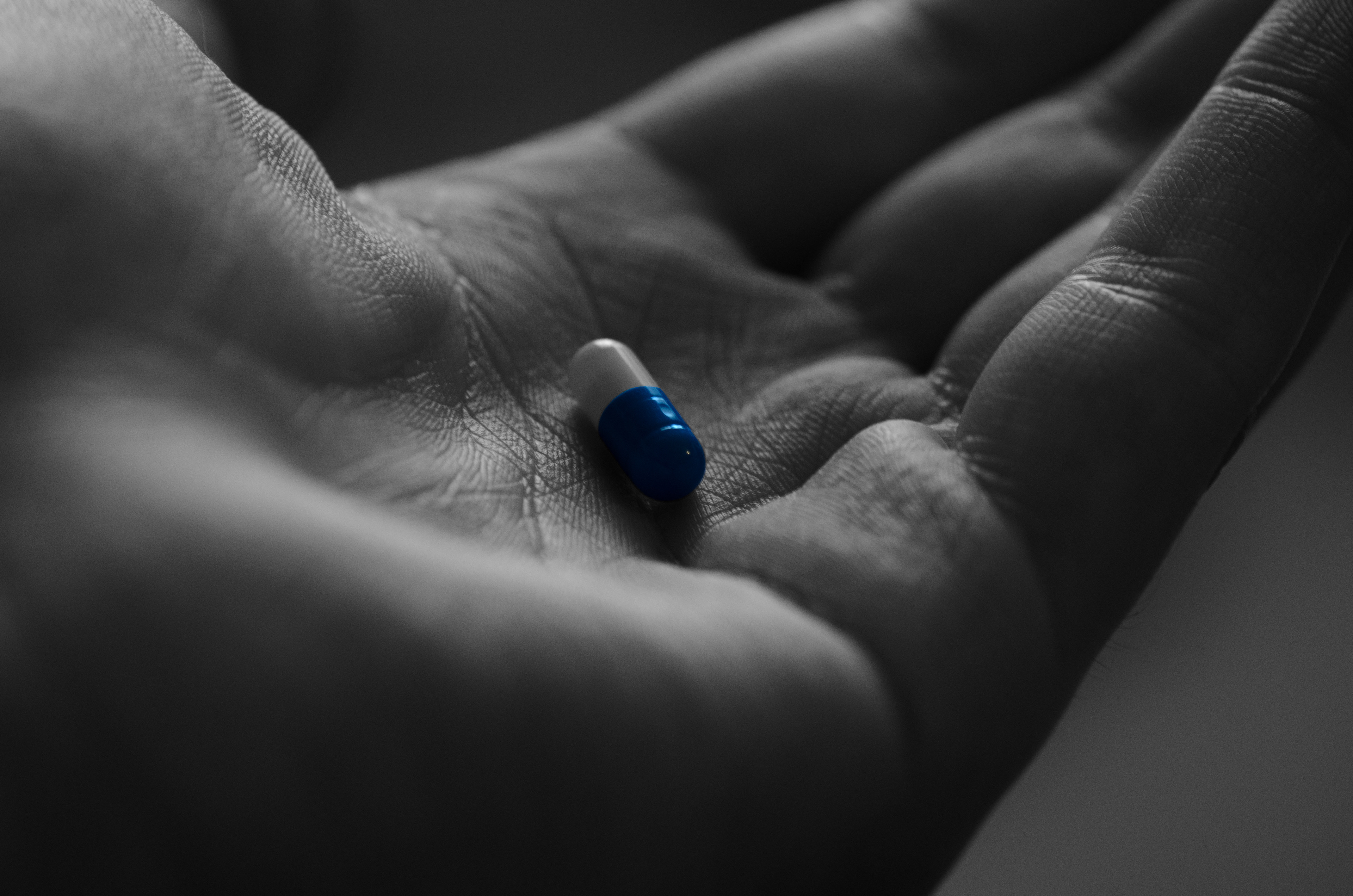 Close-up of a pill in a hand