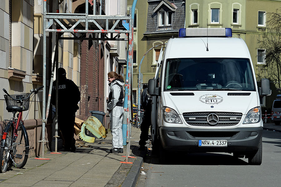 Police Officers in a street after an apartment fire was extinguished in Herne, Germany, 10 March 2017. After a manhunt, German police confirm they arrested 19-year-old Marcel H. who after his arrest pointed police to a fire in an apartment in Herne in which two bodies were found. (Photo by Sascha Steinbach/epa)