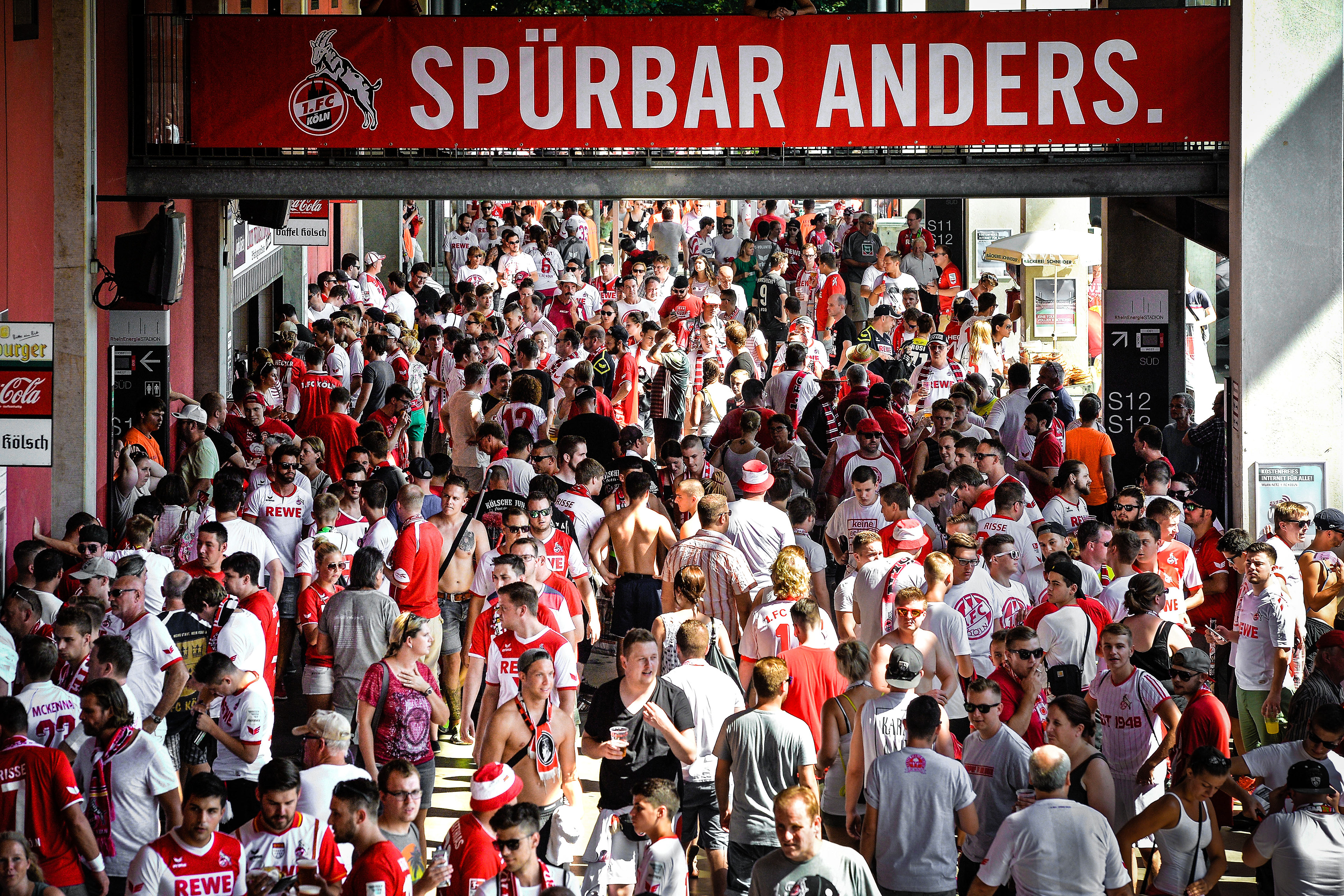 Supporters walk below the stands prior to the Bundesliga match between 1. FC Koeln and SV Darmstadt 98 at RheinEnergieStadion on August 27, 2016 in Cologne, Germany.  (Photo by Sascha Steinbach/Getty Images For 1. FC Koeln)