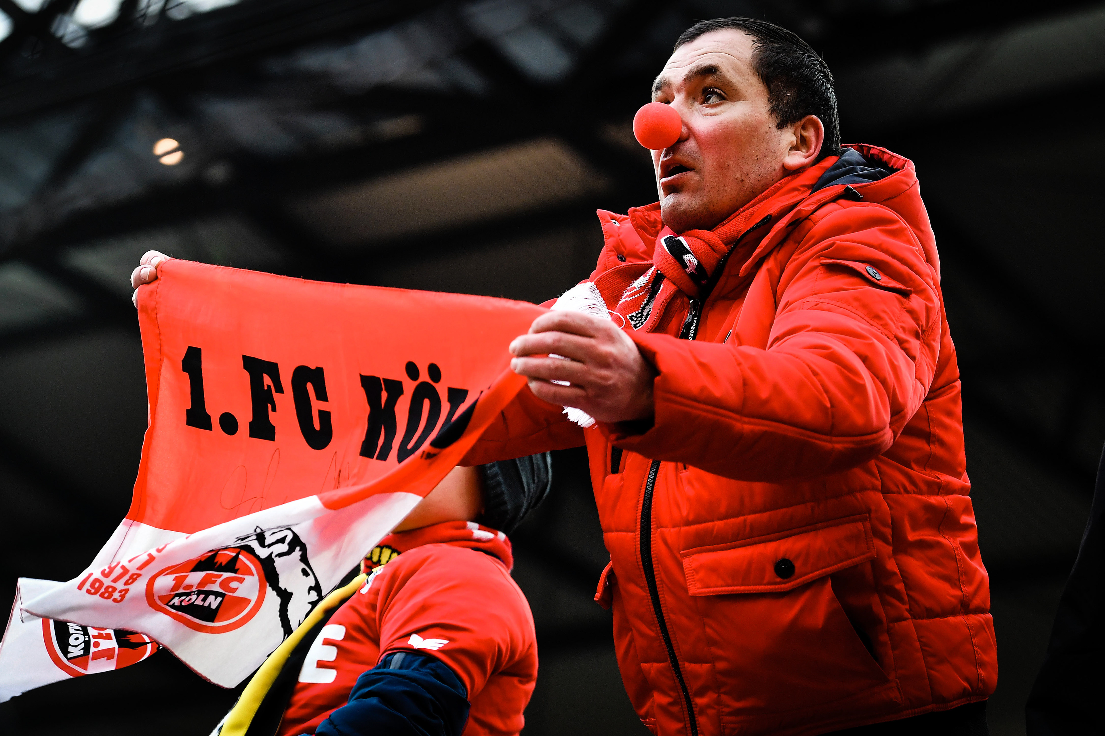 A Cologne supporter celebrates during the German Bundesliga soccer match between FC Cologne and Bayer Leverkusen at Rheinenergiestadion in Cologne, Germany, 18 March 2018. (Photo by Sascha Steinbach/epa)