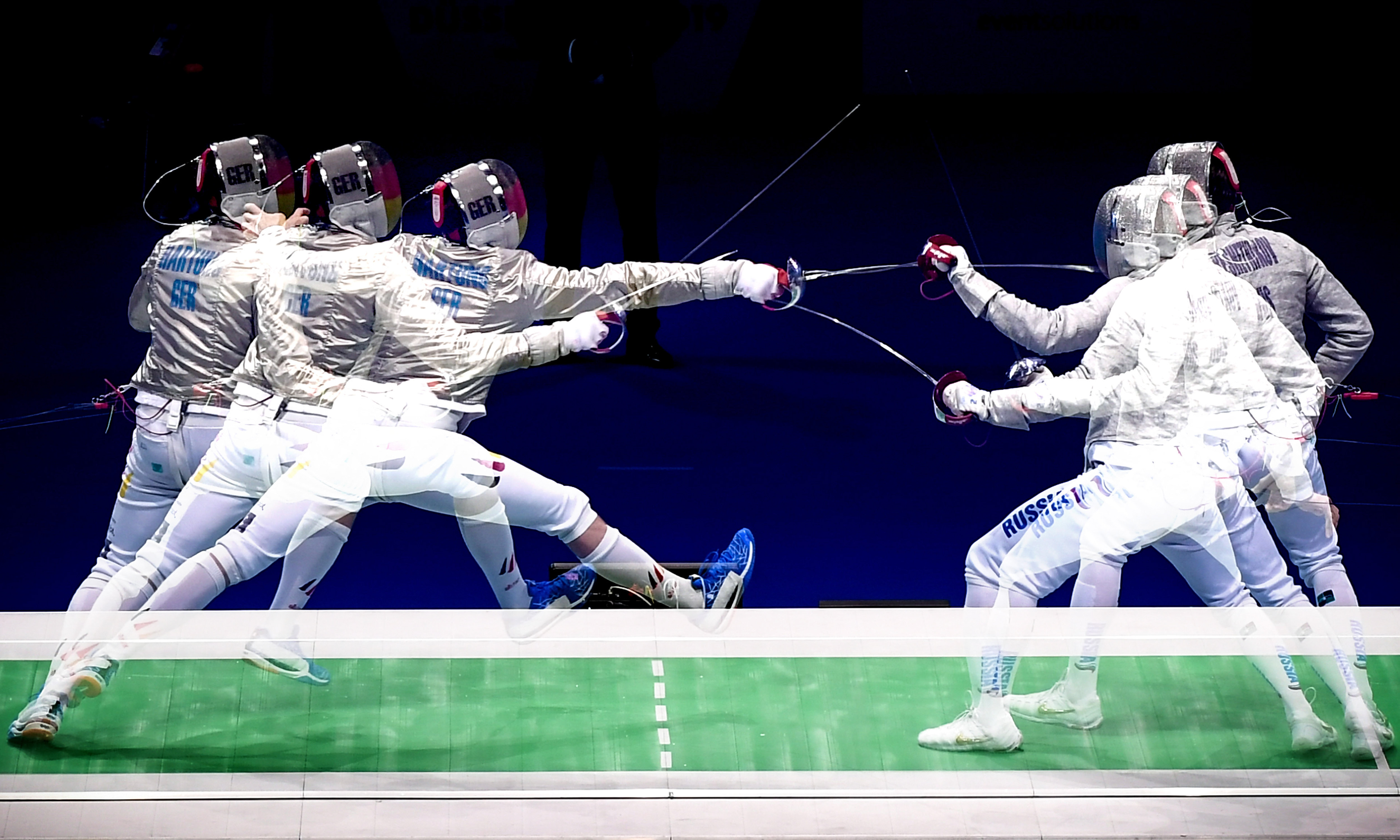 A multiple exposure picture showing Max Hartung of Germany (L) in action against Veniamin Reshetnikov of Russia (R) during the sabre men's individual semi final of the 2019 Fencing European Championships in Duesseldorf, Germany, 19 June 2019. (Photo by Sascha Steinbach/epa)