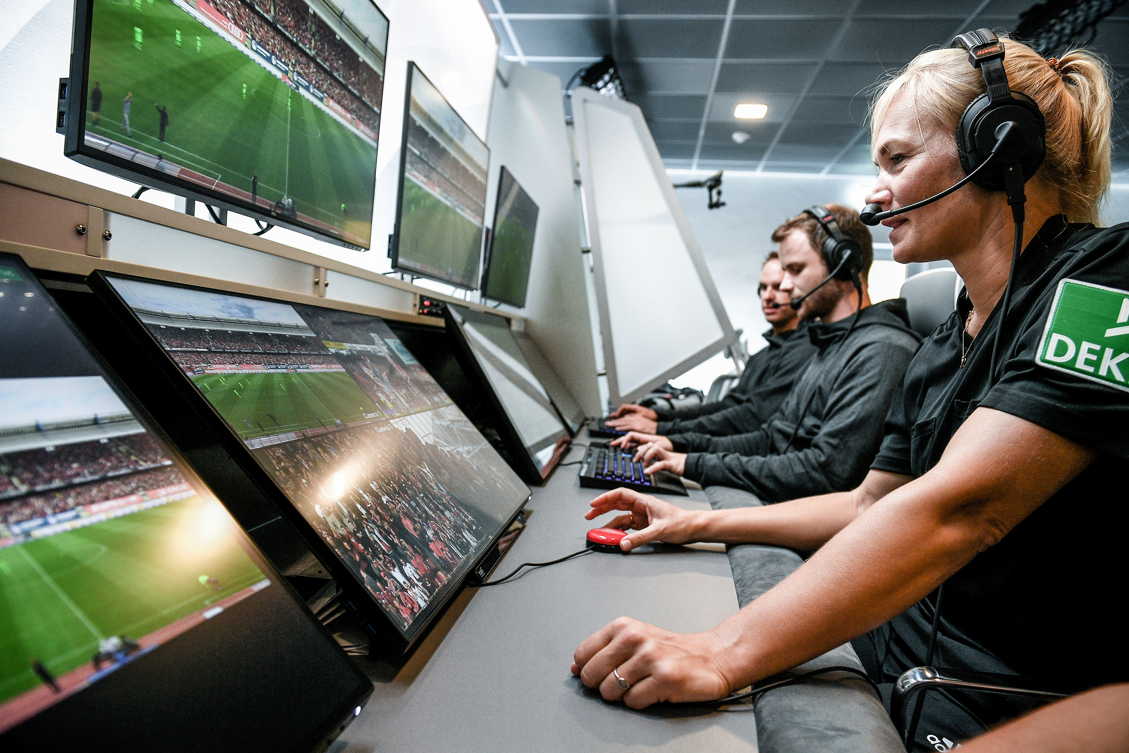 Referee Bibiana Steinhaus (R) and her colleagues sit in front of monitors in the redesigned and expanded Video Assist Center in Cologne, Germany, 05 August 2019. (Photo by Sascha Steinbach/epa)