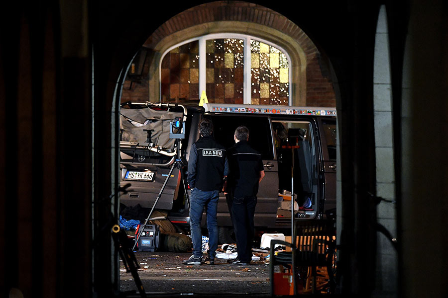 Members of the state office of criminal investigation in North Rhine-Westphalia are seen at the crime scene in the inner city of Muenster, Germany, 08 April 2018. According to the police, a man drove a van into a crowd of people in the city of Muenster, western Germany, and then killed himself on 07 April. (Photo by Sascha Steinbach/epa)