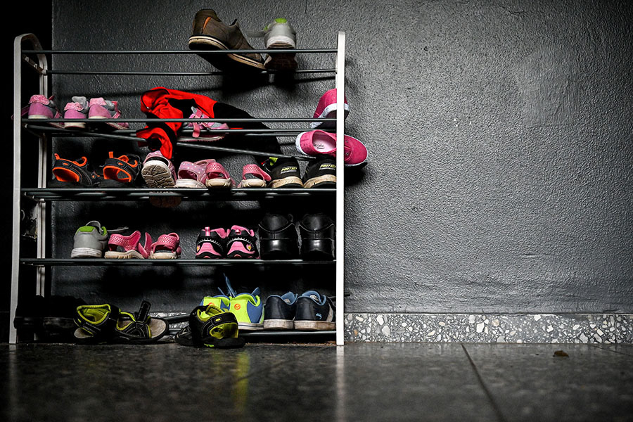 Kids shoes and a stroller are seen in front of the entrance door to an apartment that has been sealed by the police after five children found dead, in Solingen, Germany, 04 September 2020. Five dead children aged one to eight years were found in an apartment house on 03 September 2020. (Photo by Sascha Steinbach/epa)