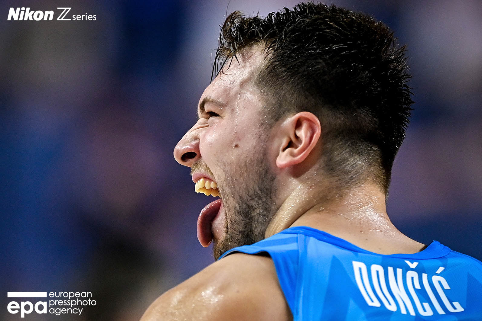 Luka Doncic of Slovenia (L) in action against Vincent Poirier of France (R) during the FIBA EuroBasket 2022 group B stage match between France and Slovenia in Cologne, Germany, 07 September 2022.
