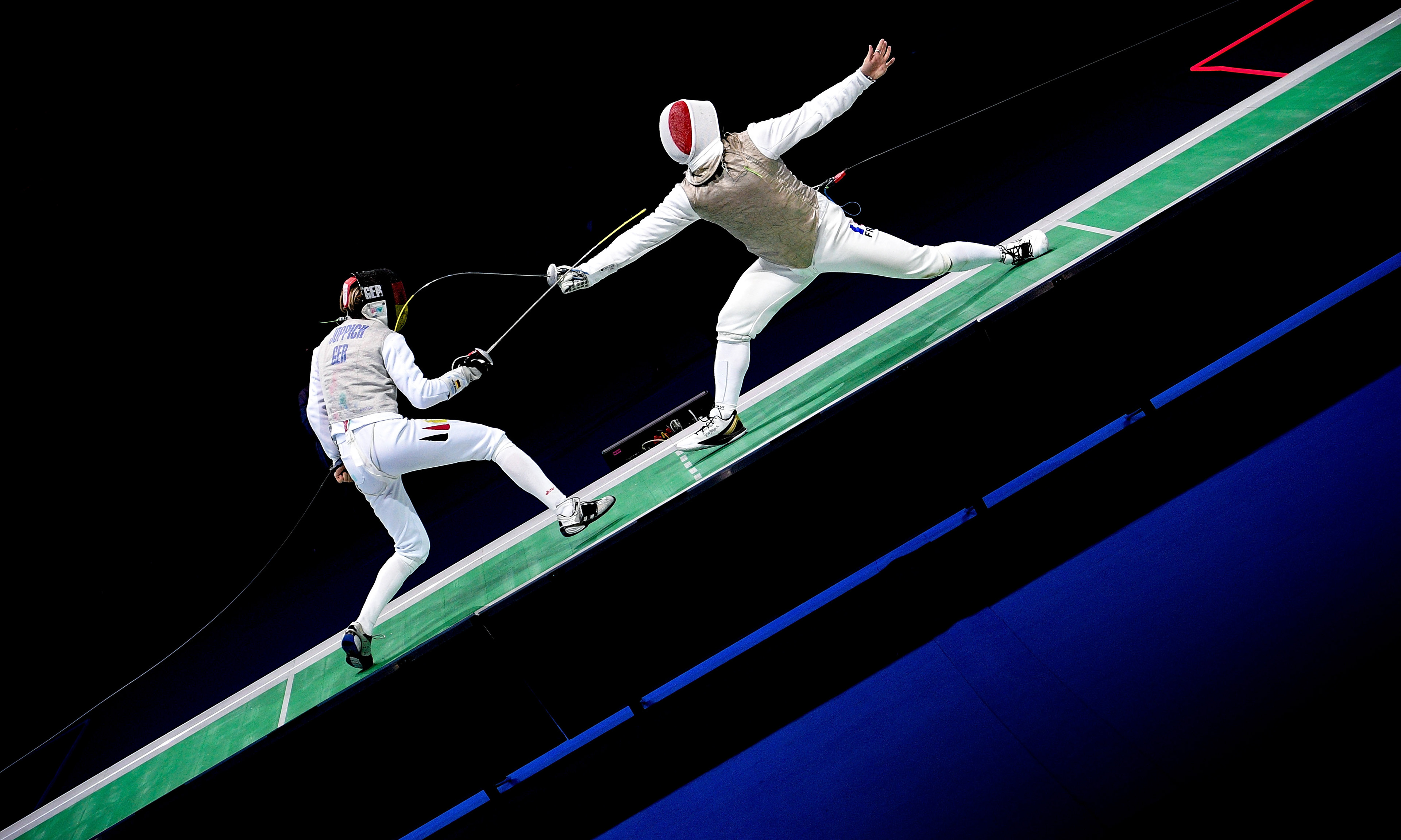 Athletes of Germany (L) and France (R) compete in the foil men's team final of the 2019 Fencing European Championships in Duesseldorf, Germany, 20 June 2019. (Photo by Sascha Steinbach/epa)