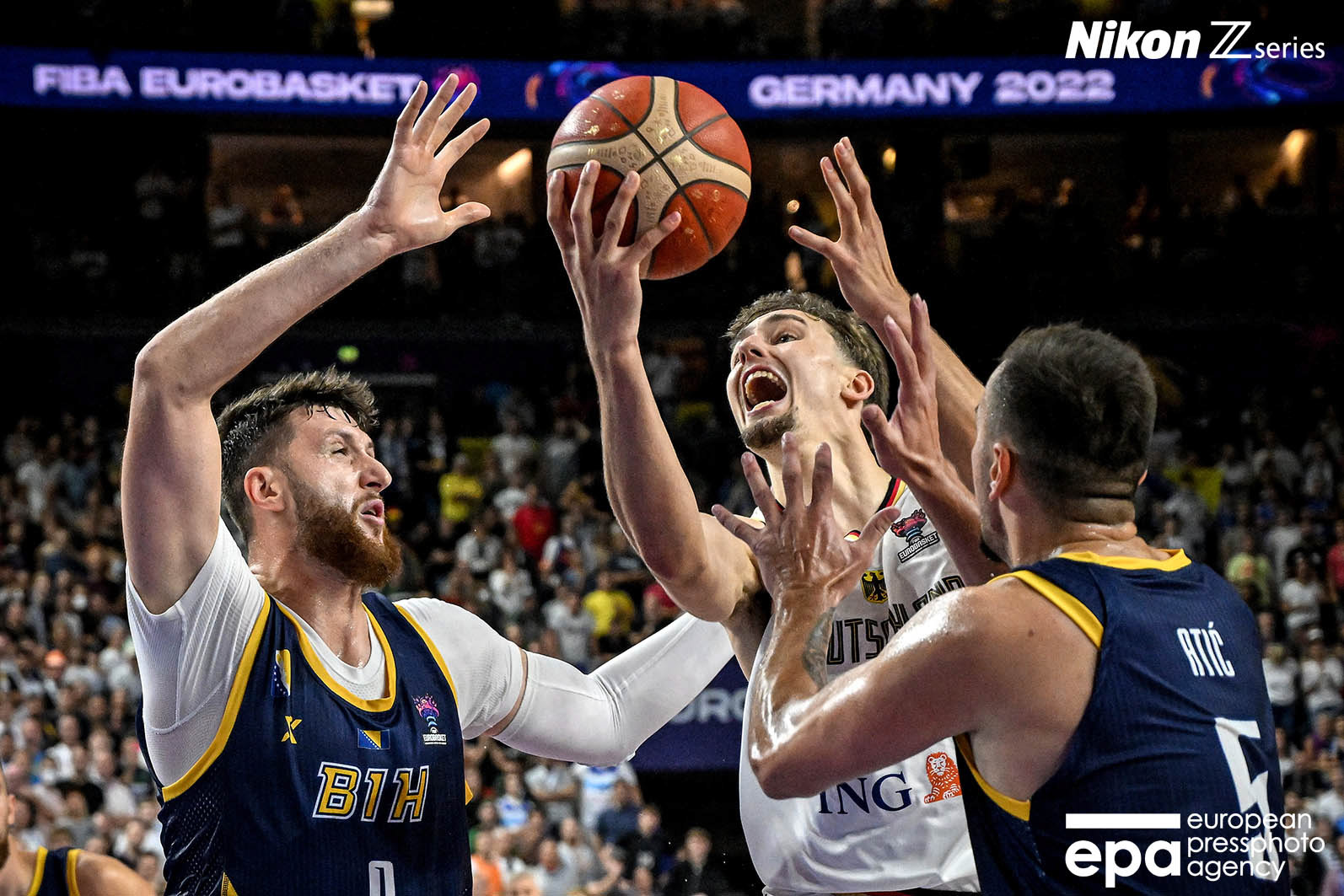 Franz Wagner of Germany (C) in action against Jusuf Nurkic (L) and Edin Atic (R) of Bosnia and Herzegovina during the FIBA EuroBasket 2022 group B stage match between Germany and Bosnia and Herzegovina in Cologne, Germany, 03 September 2022.