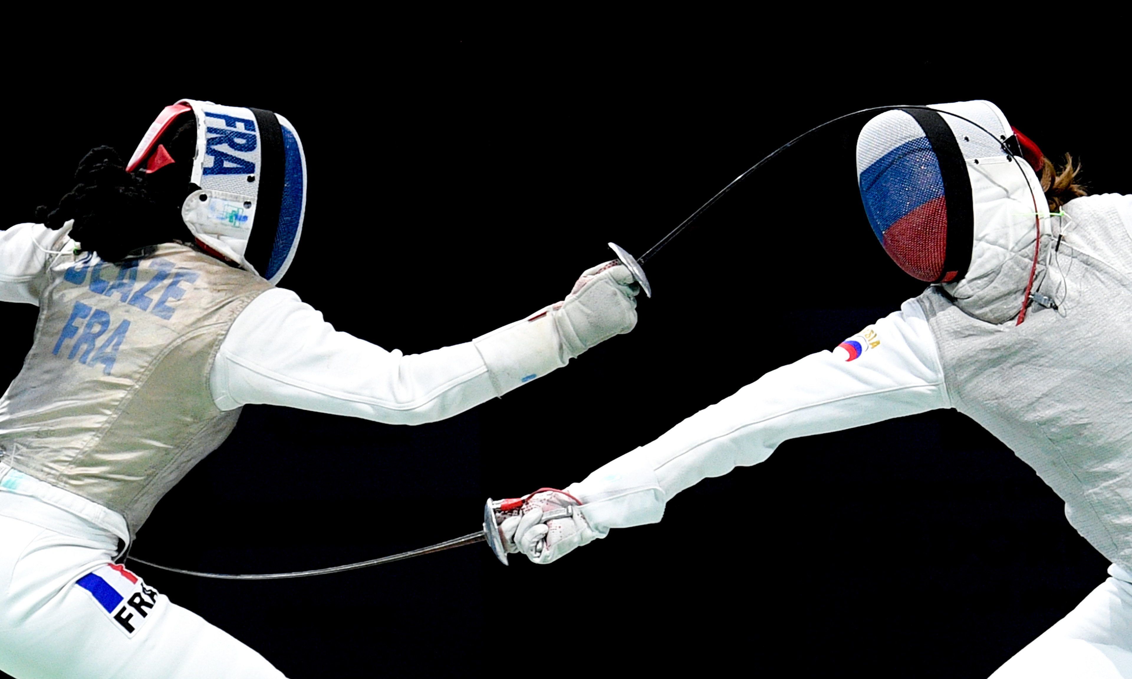 Athletes of France (L) and Russia (R) compete in the foil women's team final of the 2019 Fencing European Championships in Duesseldorf, Germany, 21 June 2019. (Photo by Sascha Steinbach/epa)