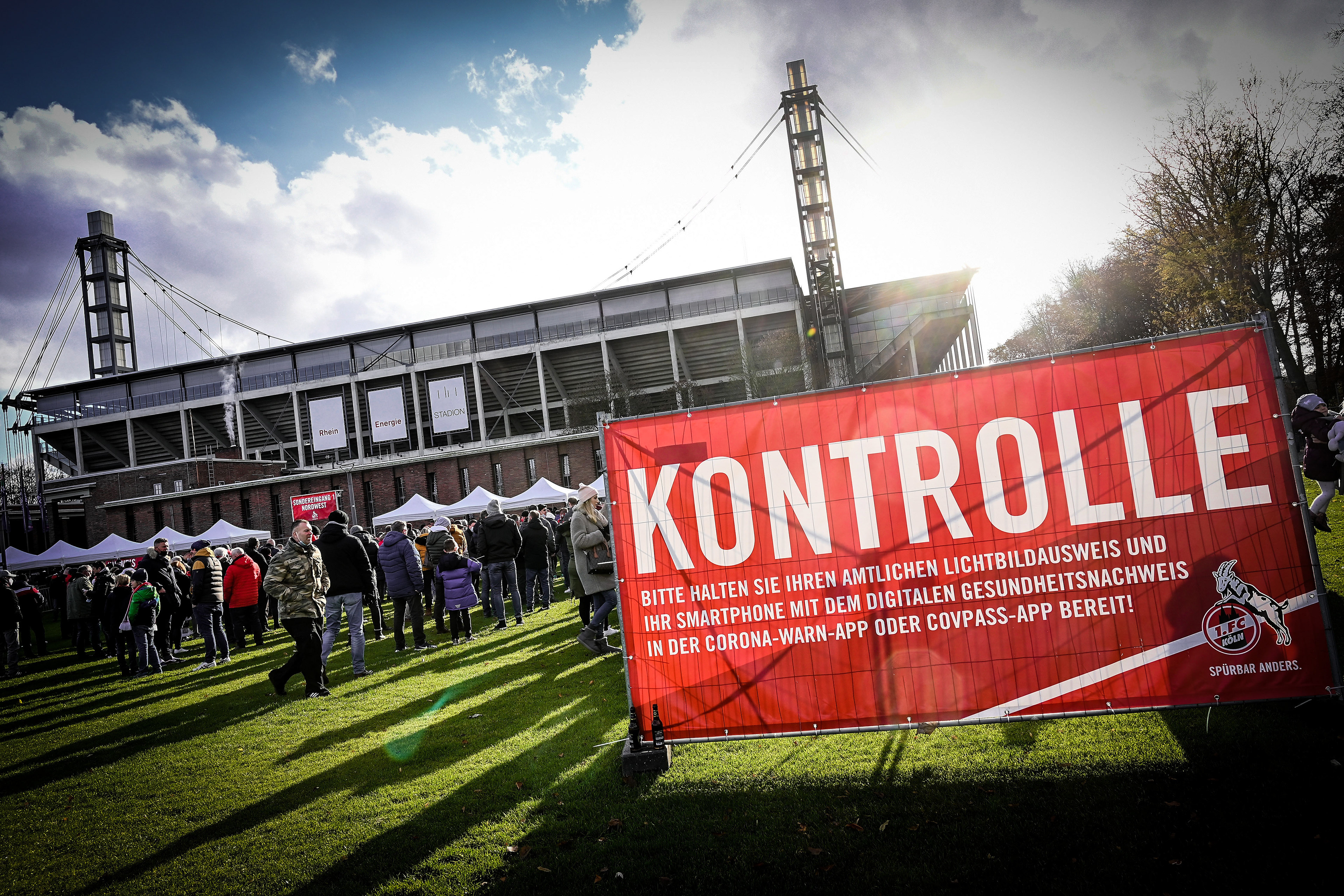 Fans queue in front of the stadium prior to the German Bundesliga soccer match between 1. FC Koeln and Borussia Moenchengladbach at Rheinenergiestadion in Cologne, Germany, 27 November 2021. (Photo by Sascha Steinbach/epa)