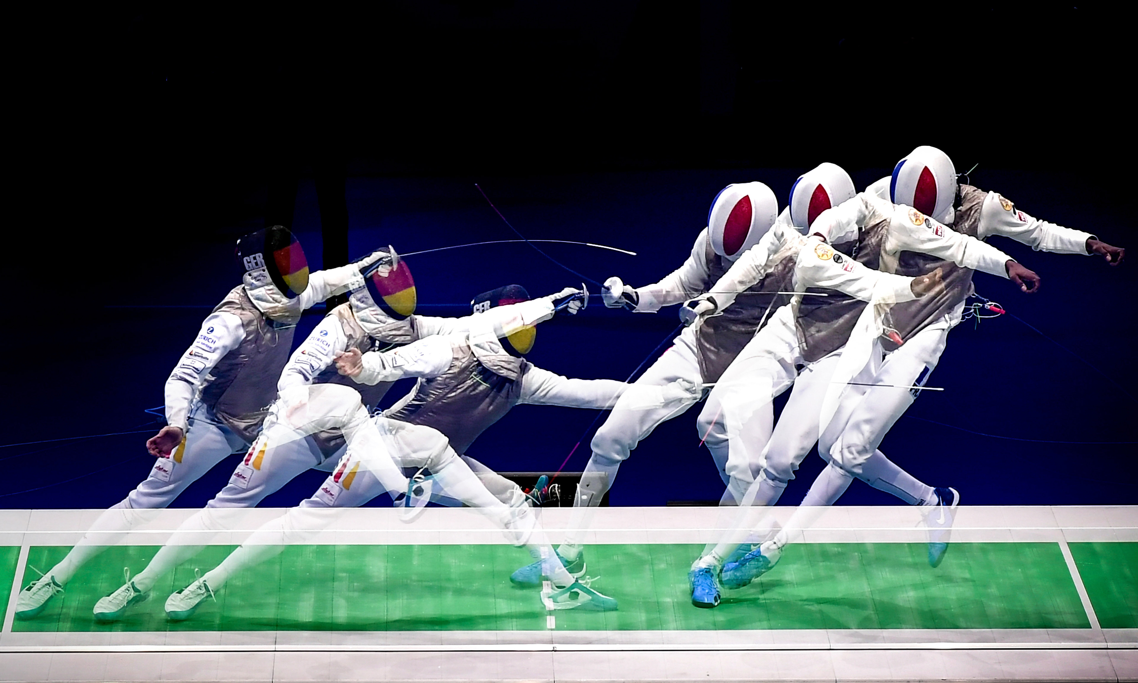 A multiple exposure picture showing Ewa Trzebinska of Poland (L) in action against Marie-Florence Candassamy of France (R) during the epee women's individual semi final of the 2019 Fencing European Championships in Duesseldorf, Germany, 19 June 2019. (Photo by Sascha Steinbach/epa)