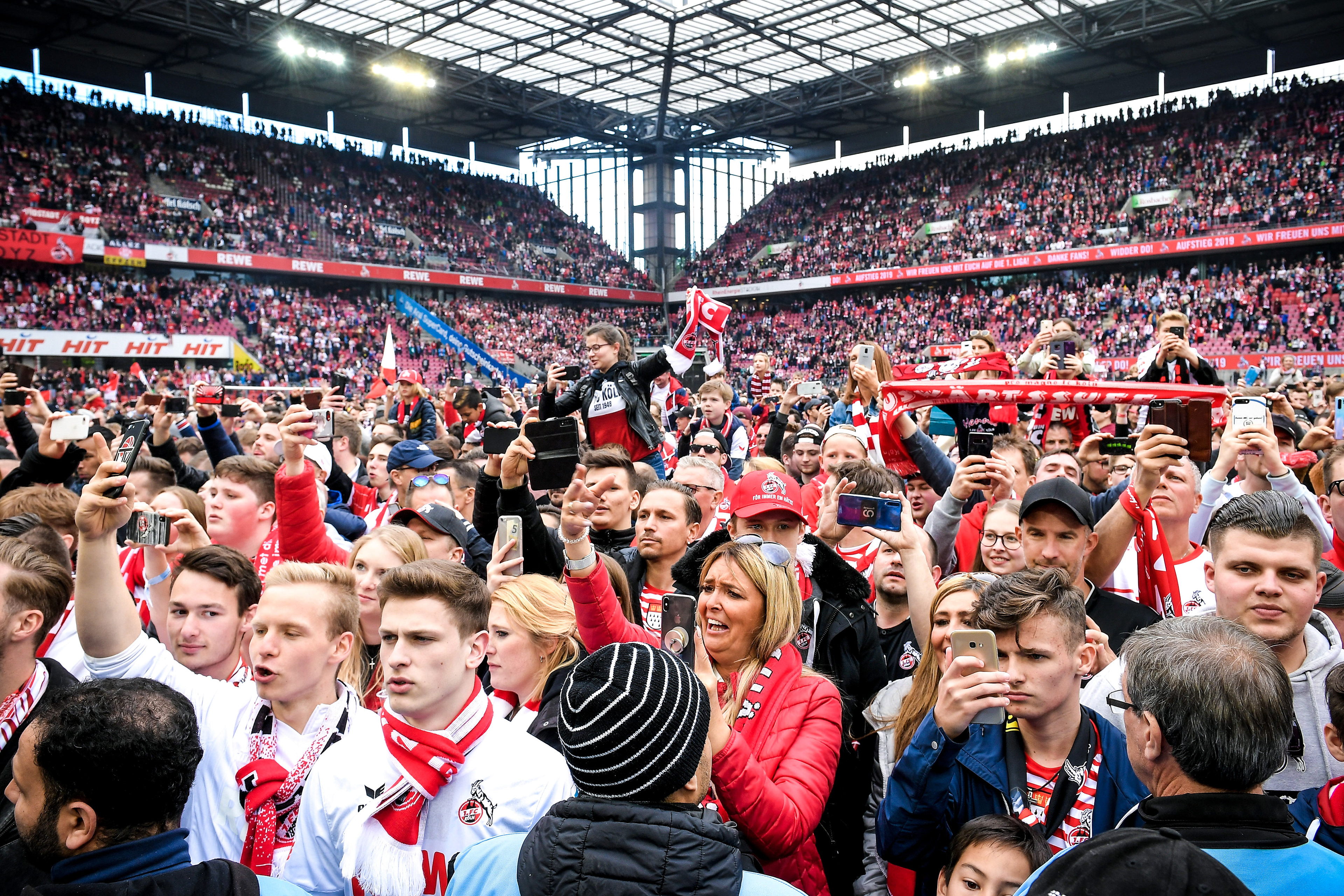 Cologne supporters enter the pitch after the German Bundesliga second division soccer match between 1. FC Cologne and SSV Jahn Regensburg in Cologne, Germany, 12 May 2019. (Photo by Sascha Steinbach/epa)
