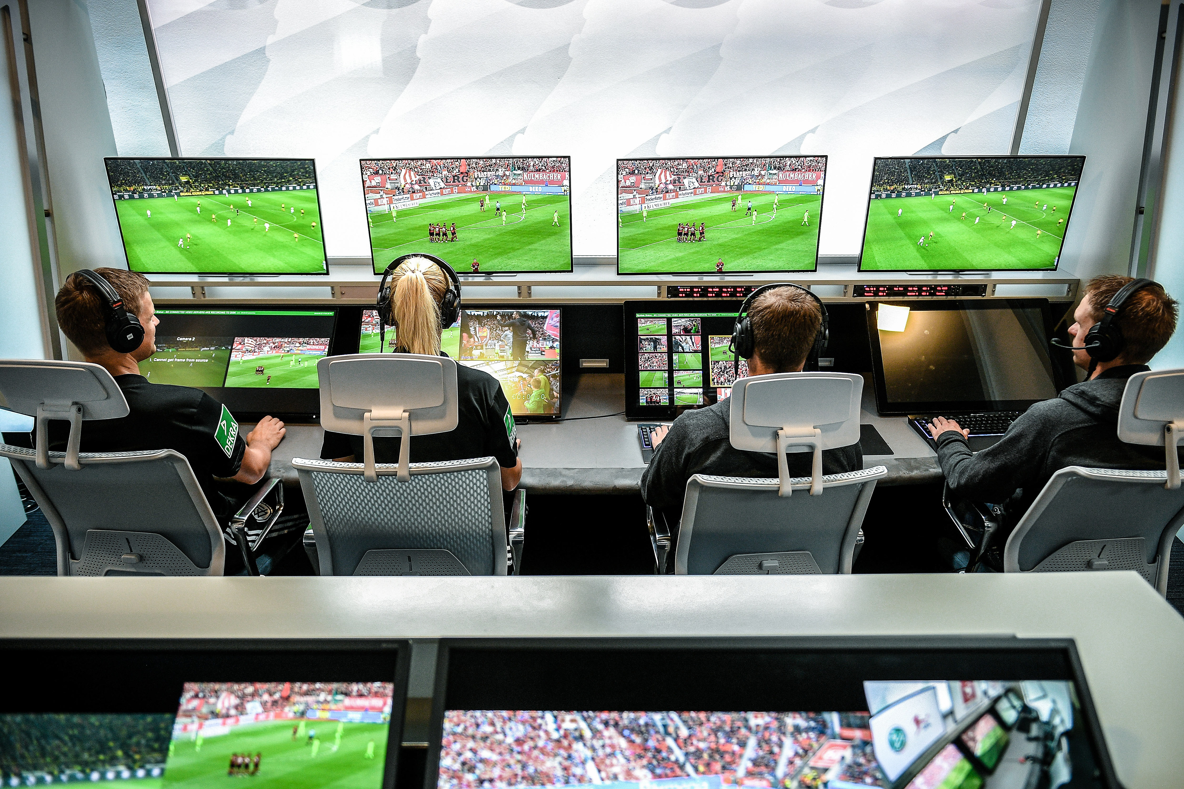 Referee Bibiana Steinhaus (2-L) and her colleagues sit in front of monitors in the redesigned and expanded Video Assist Center in Cologne, Germany, 05 August 2019. (Photo by Sascha Steinbach/epa)