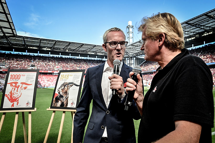 CEO Alexander Wehrle (L) of 1. FC Koeln talks to stadium TV prior to the Bundesliga match between 1. FC Koeln and SV Darmstadt 98 at RheinEnergieStadion on August 27, 2016 in Cologne, Germany.  (Photo by Sascha Steinbach/Getty Images For 1. FC Koeln)