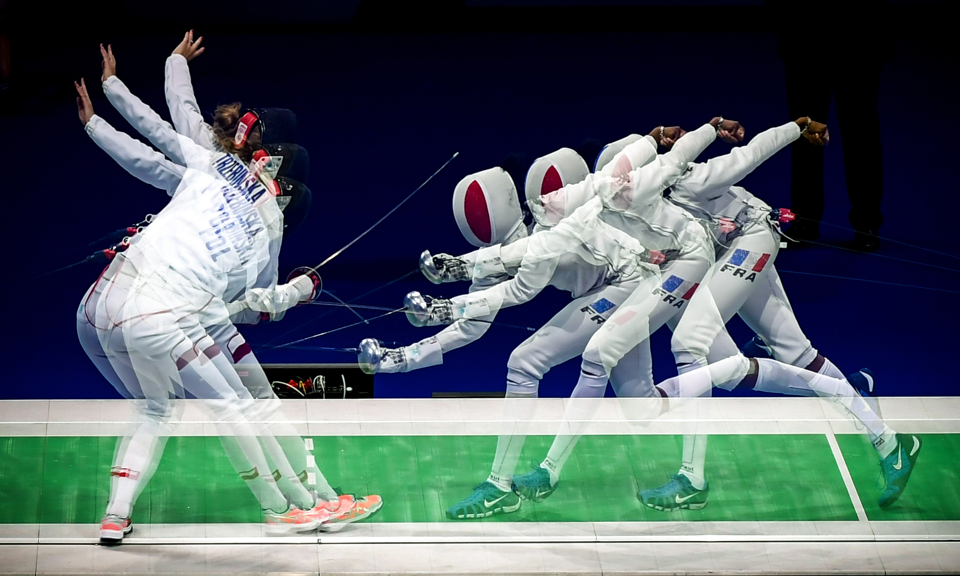 A multiple exposure picture showing Ewa Trzebinska of Poland (L) in action against Marie-Florence Candassamy of France (R) during the epee women's individual semi final of the 2019 Fencing European Championships in Duesseldorf, Germany, 19 June 2019. (Photo by Sascha Steinbach/epa)