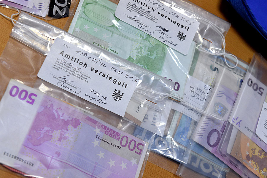 Confiscated weapons, drugs, cash money about 330,000 € and other items are on display at the main customs office in Krefeld, Germany, 30 January 2018. Thousands of special police and customs units were engaged in nationwide raids targeting organised illicit labour. (Photo by Sascha Steinbach/epa)