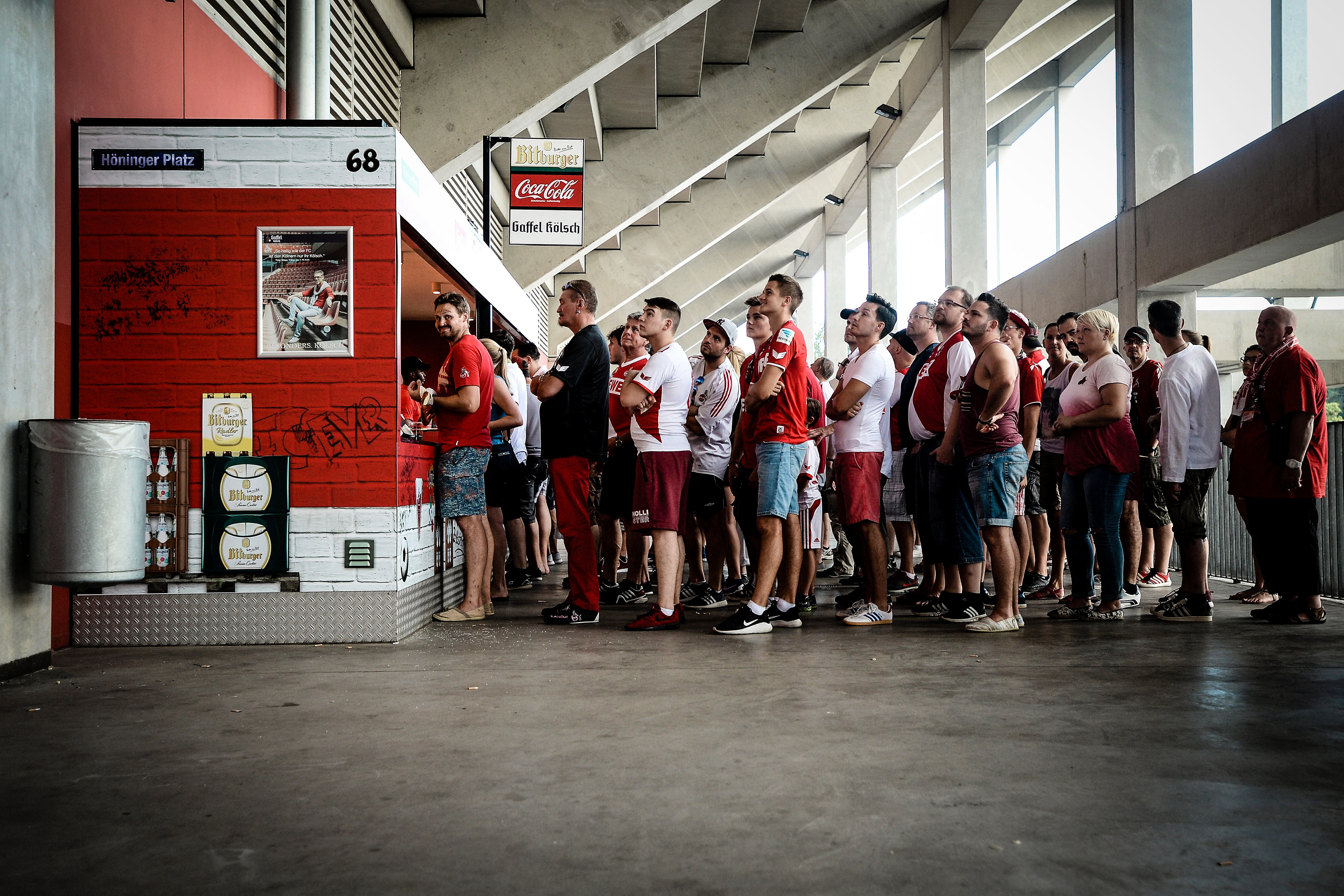 Supporters queue in front of a snack stand during the Bundesliga match between 1. FC Koeln and SV Darmstadt 98 at RheinEnergieStadion on August 27, 2016 in Cologne, Germany.  (Photo by Sascha Steinbach/Getty Images For 1. FC Koeln)