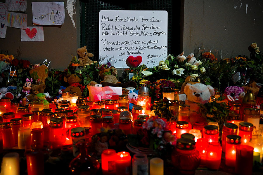 Flowers, candles and soft toys are placed in front of an apartment building where five children were found dead in Solingen, Germany, 06 September 2020. Five dead children aged one to eight years were found dead in an apartment house on 03 September 2020. (Photo by Sascha Steinbach/epa)
