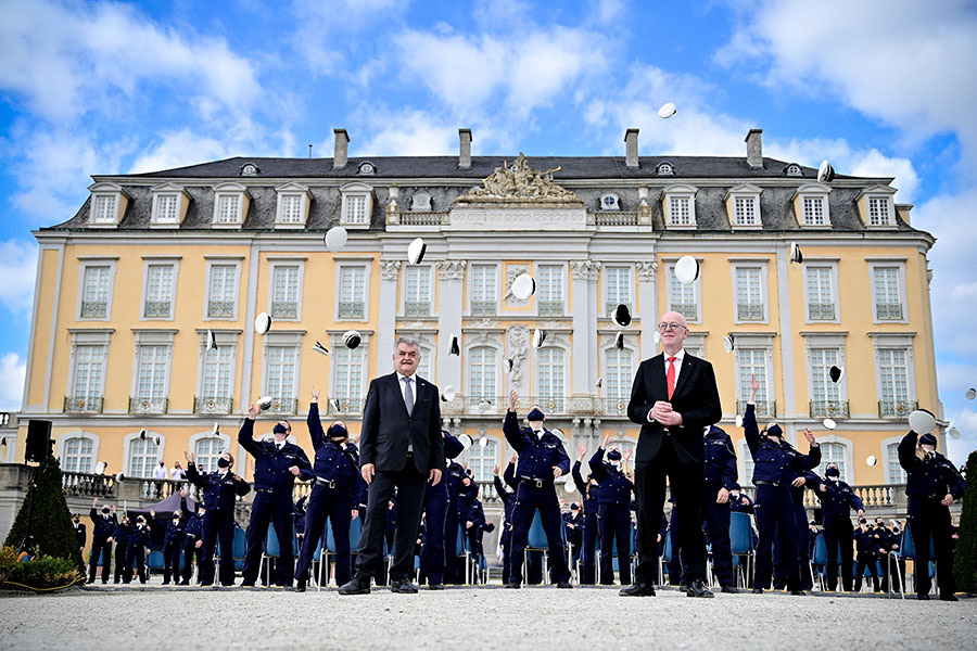 2,500 police officers throw their caps in the air after taking their oath of allegiance to the state constitution in front of Augustusburg Castle, a UNESCO World Heritage Site, in Bruehl, Germany, 09 September 2020. (Photo by Sascha Steinbach/epa)