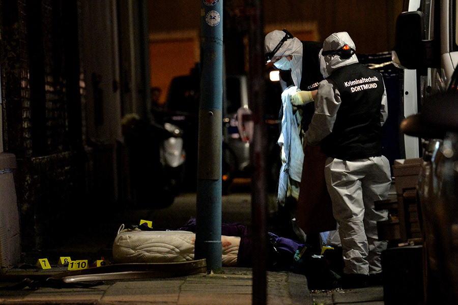Police Officers in a street after an apartment fire was extinguished in Herne, Germany, 09 March 2017. After a manhunt, German police confirme they arrested 19-year-old Marcel H. who after his arrest pointed police to a fire in an apartment in Herne in which two bodies were found. (Photo by Sascha Steinbach/epa)