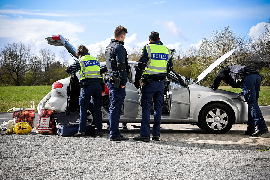 German customs and border officers control the crossing of vehicles at the German-Dutch border of Venlo near Kaldenkirchen, Germany, 06 April 2021. The German government has heightened measures to stem the spread of the coronavirus disease (COVID-19), which is caused by the SARS-CoV-2 virus, and declared the Netherlands a high-incidence country. (Photo by Sascha Steinbach/epa)