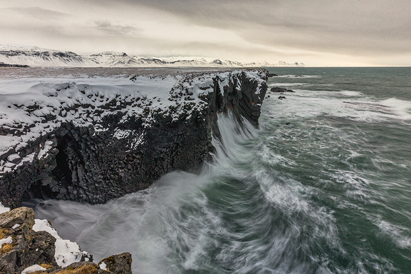 Waves at sea cliffs in Arnarstapi