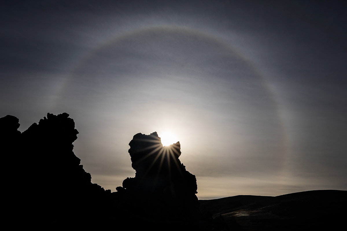Trolls having a conversation under sun halo
