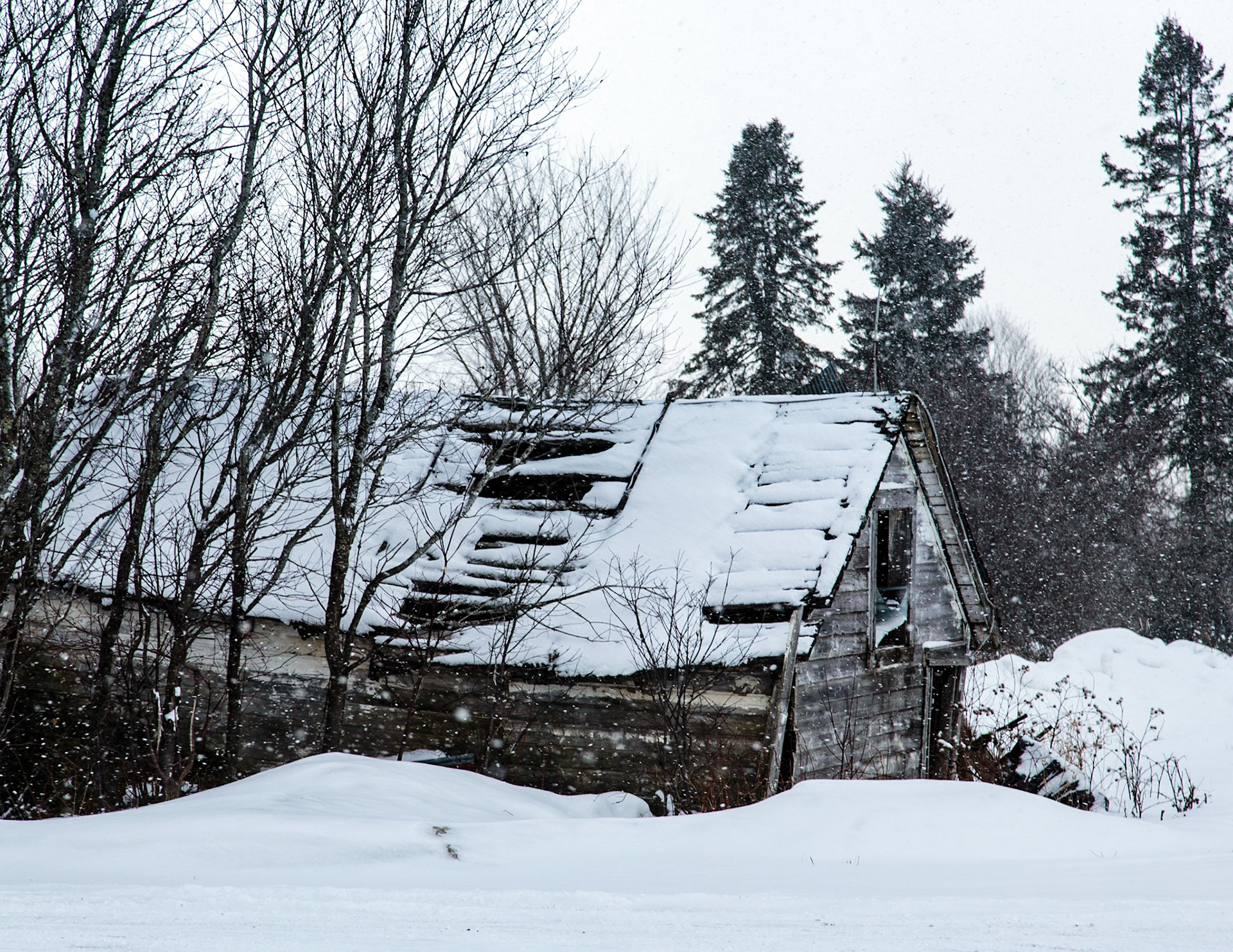 Old abandoned building in snowfall