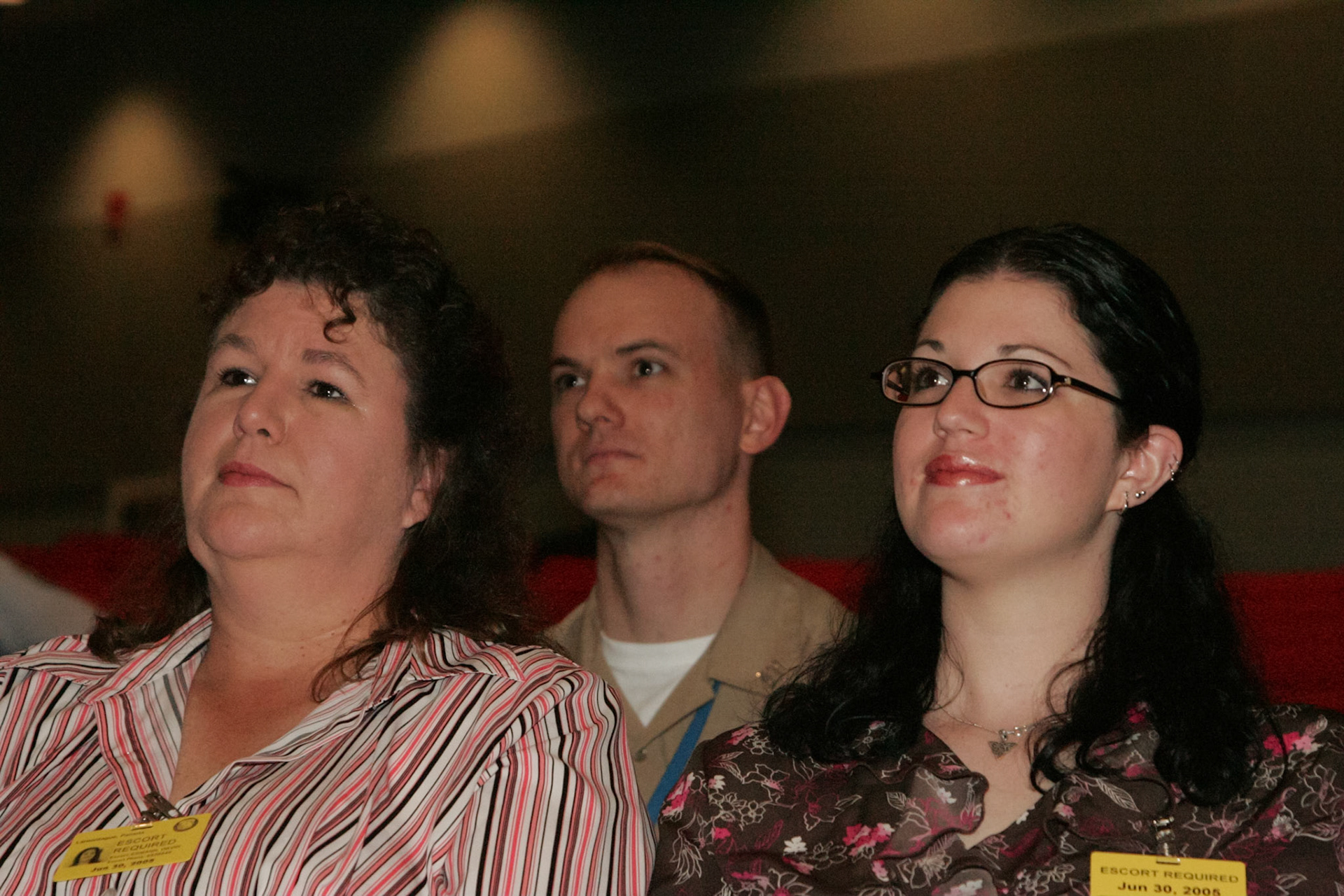 Family watching slideshow presentation at retirement ceremony - Pentagon, Washington, DC