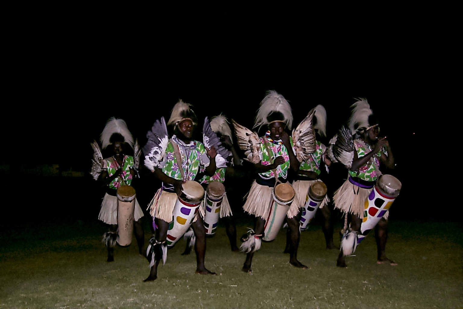 Locals performing at safari camp at night - Kenya