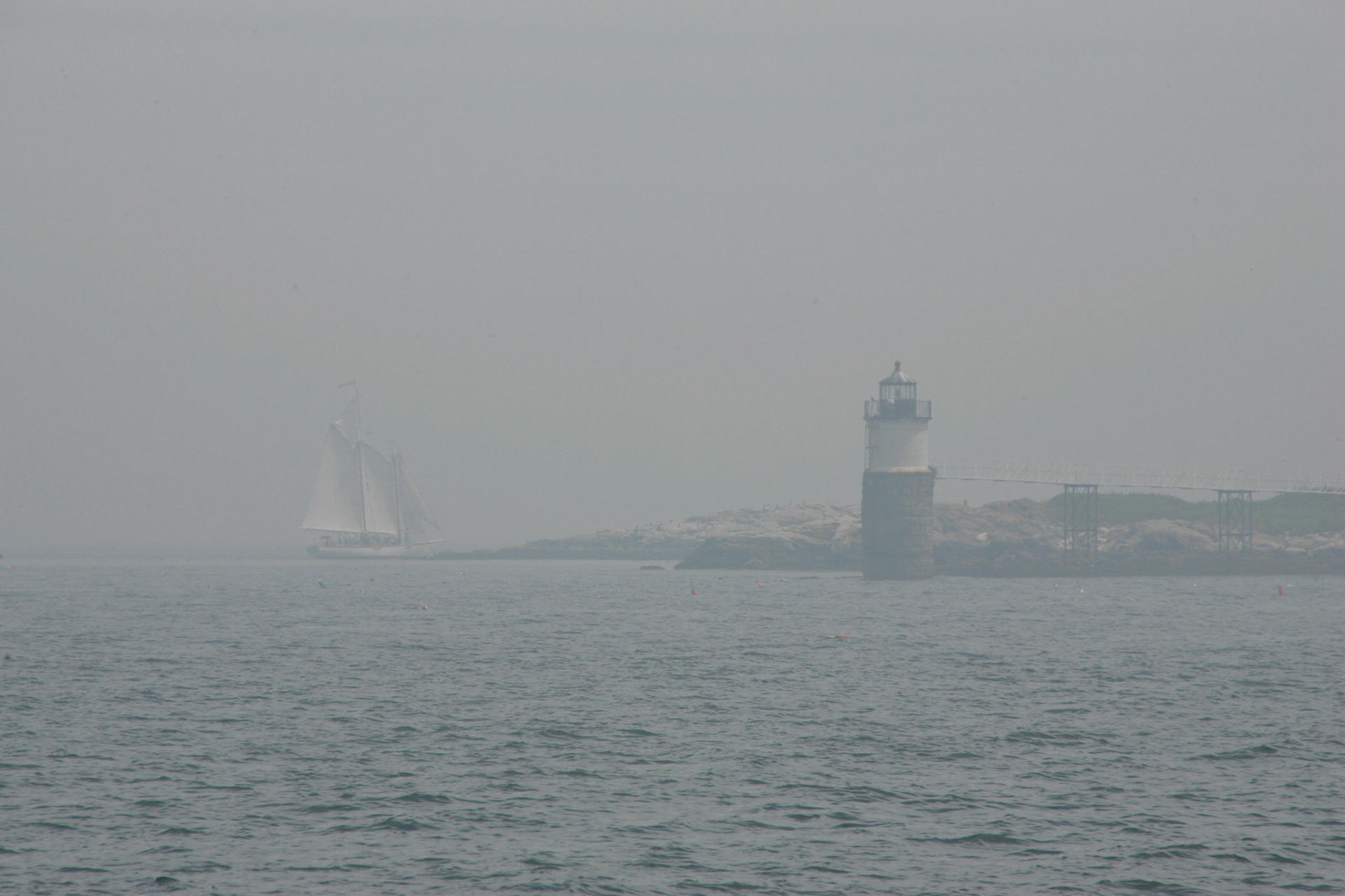 Two-masted schooner on foggy morning - Isle au Haut Lighthouse, Isle au Haut ME