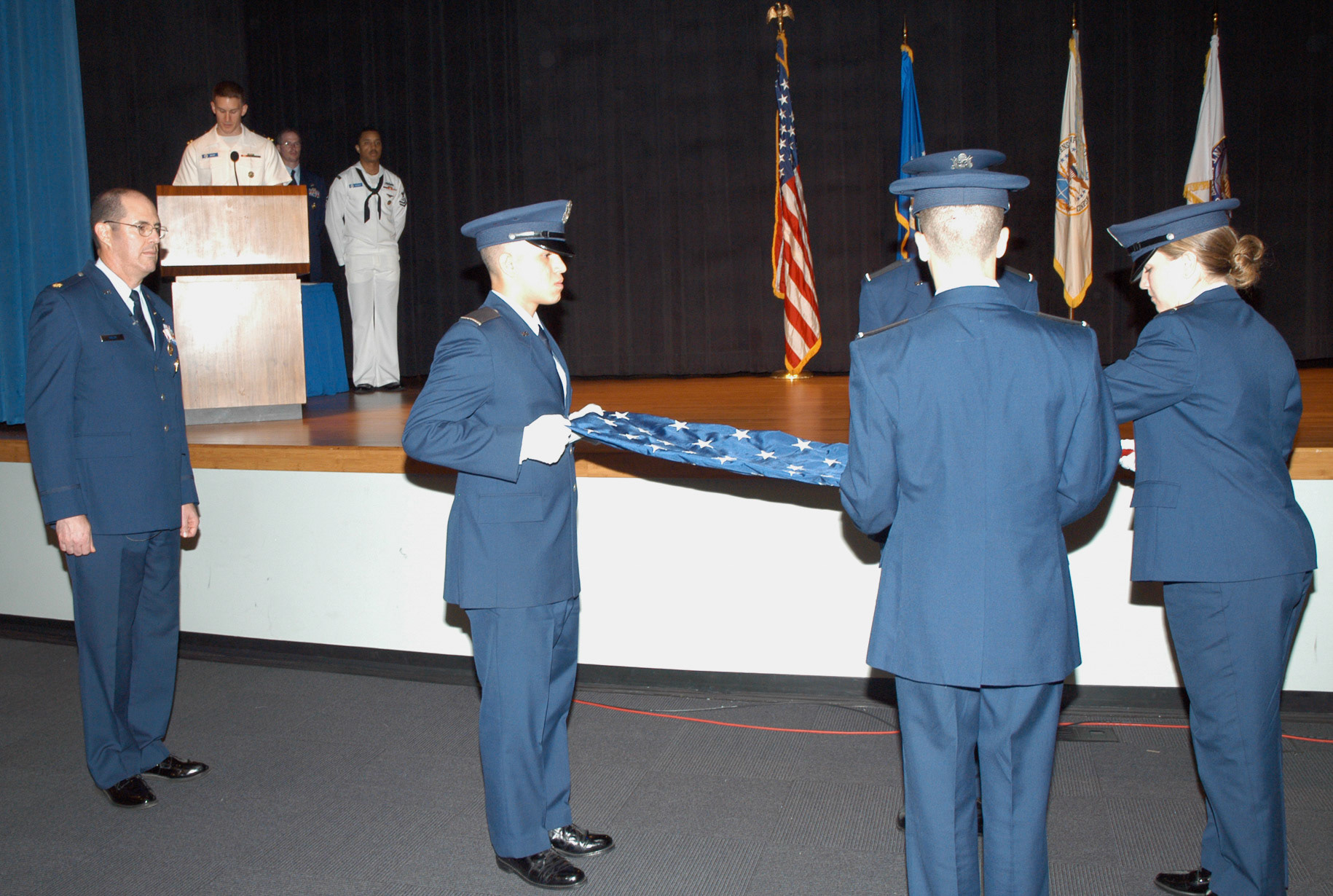 Folding and presentation of retirement flag - UF ROTC Det 150 cadets from Billy Mitchell Drill Team, Pentogon, Washington, DC