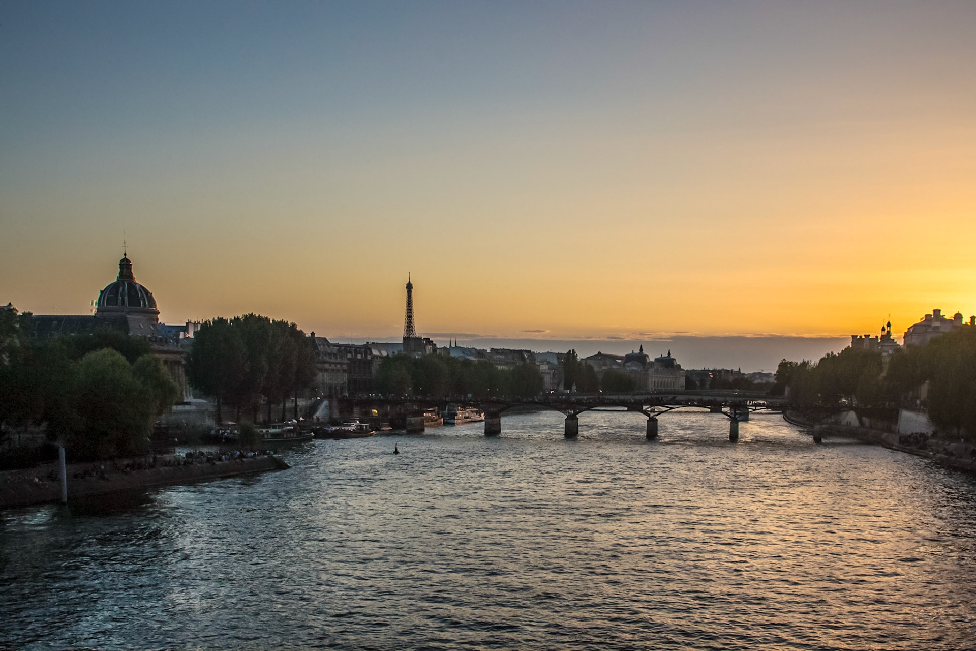 Eiffel Tower from bridge crossing the Seine river - Paris, France
