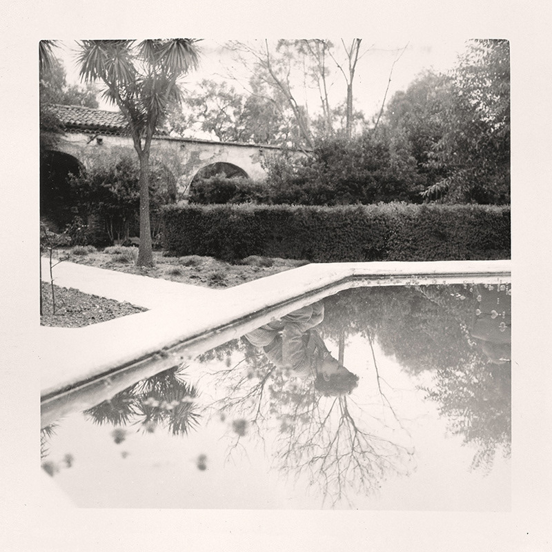 Traces: Woman Kneeling by Pond. Greg Sand.