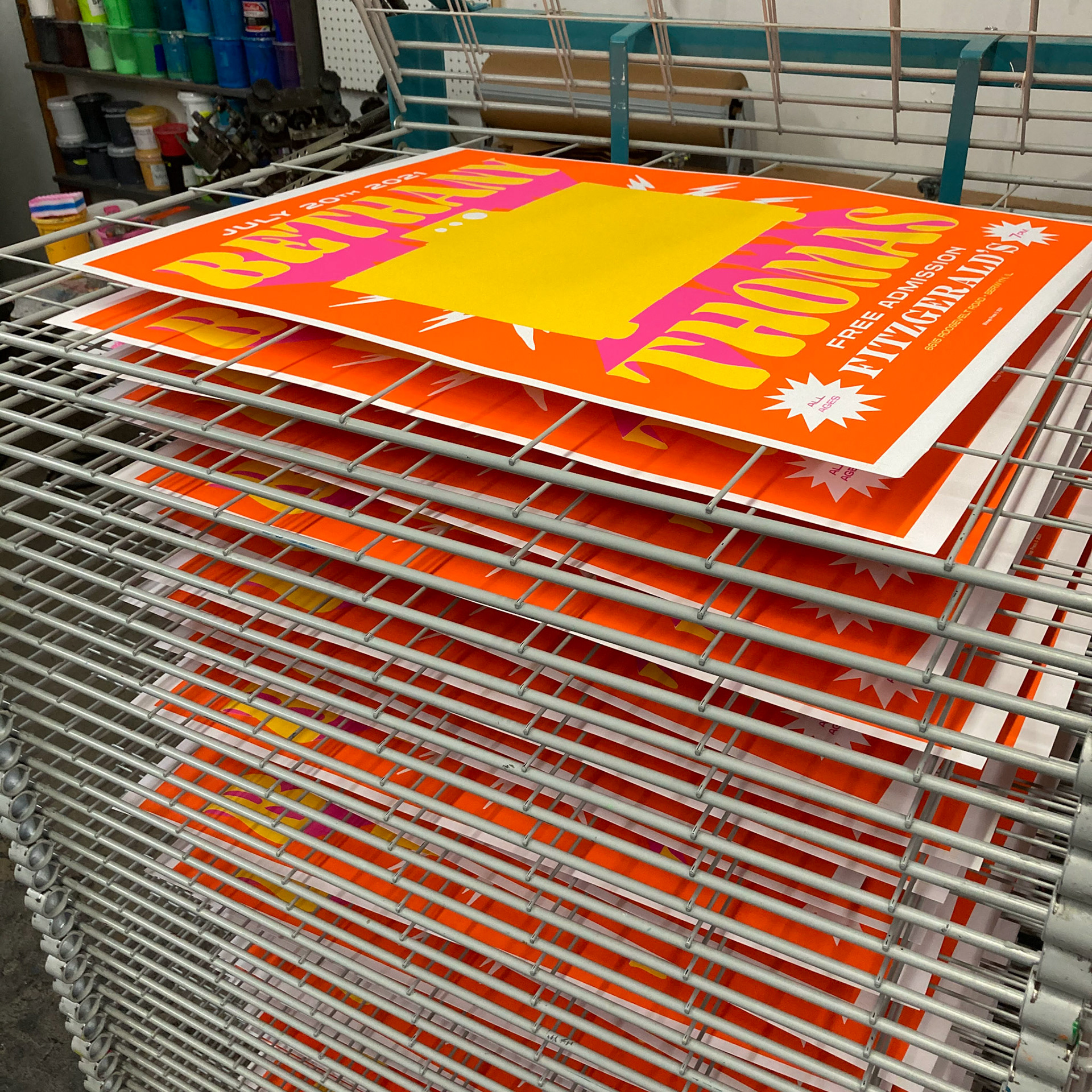 Gig posters drying before final layer